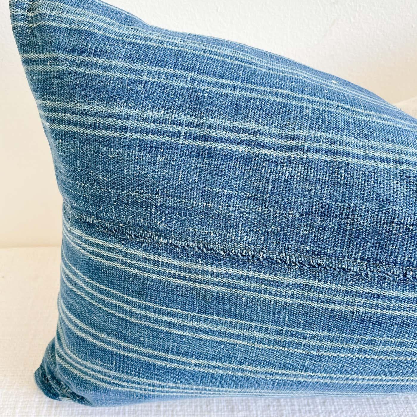 This vintage textile pillow face features a vintage batik front, natural linen backing, and original hand embroidery. The backing is 100% Belgian linen in natural linen. Our pillows are constructed with vintage one of a kind textiles from around the
