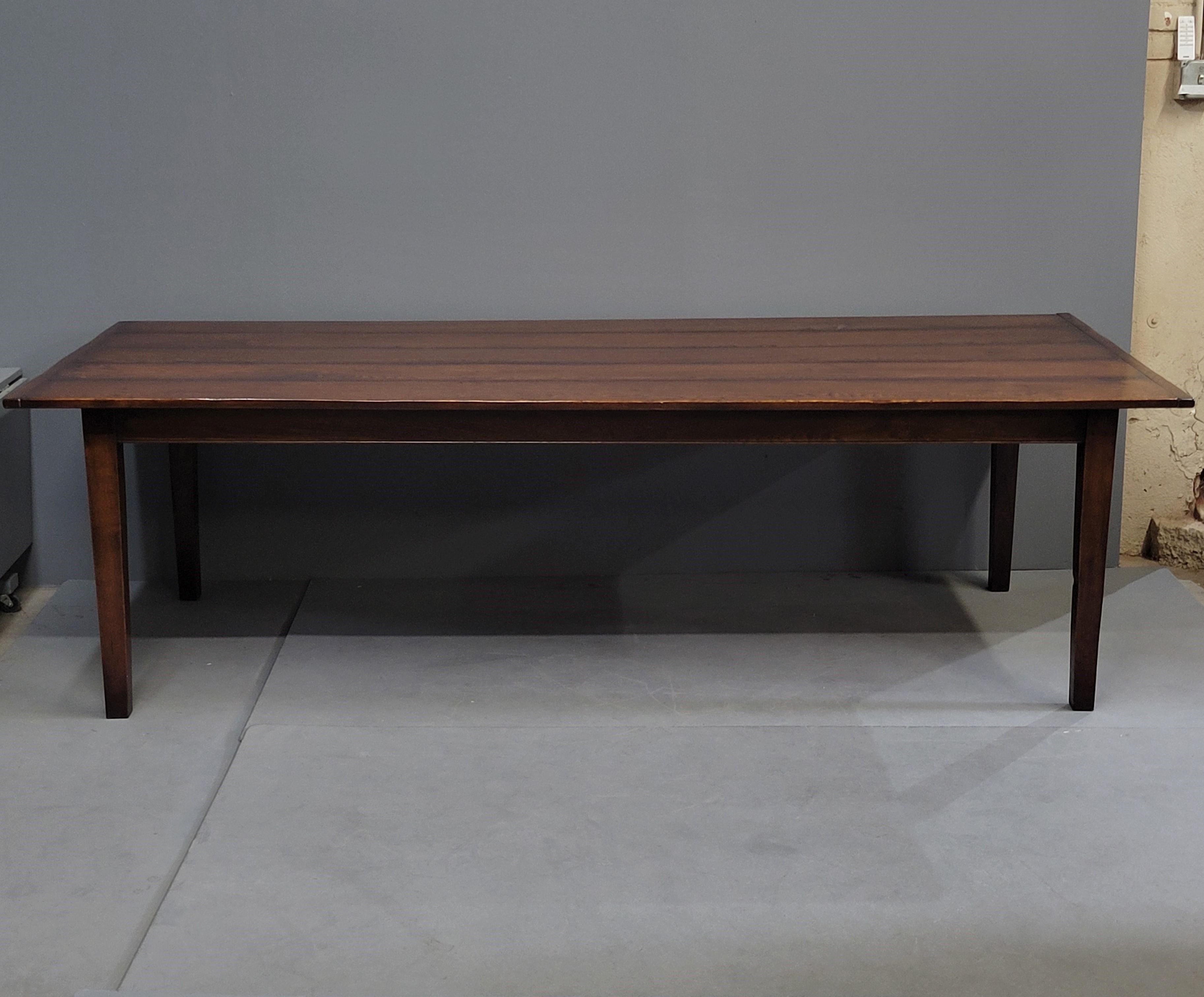 A gorgeous vintage English oak 8.5' long farmhouse table. Beautifully constructed with a hand chamfered table top. Features thin breadboard ends and classic shaker style legs. Custom made by a furniture maker in England and imported into the U.S. A