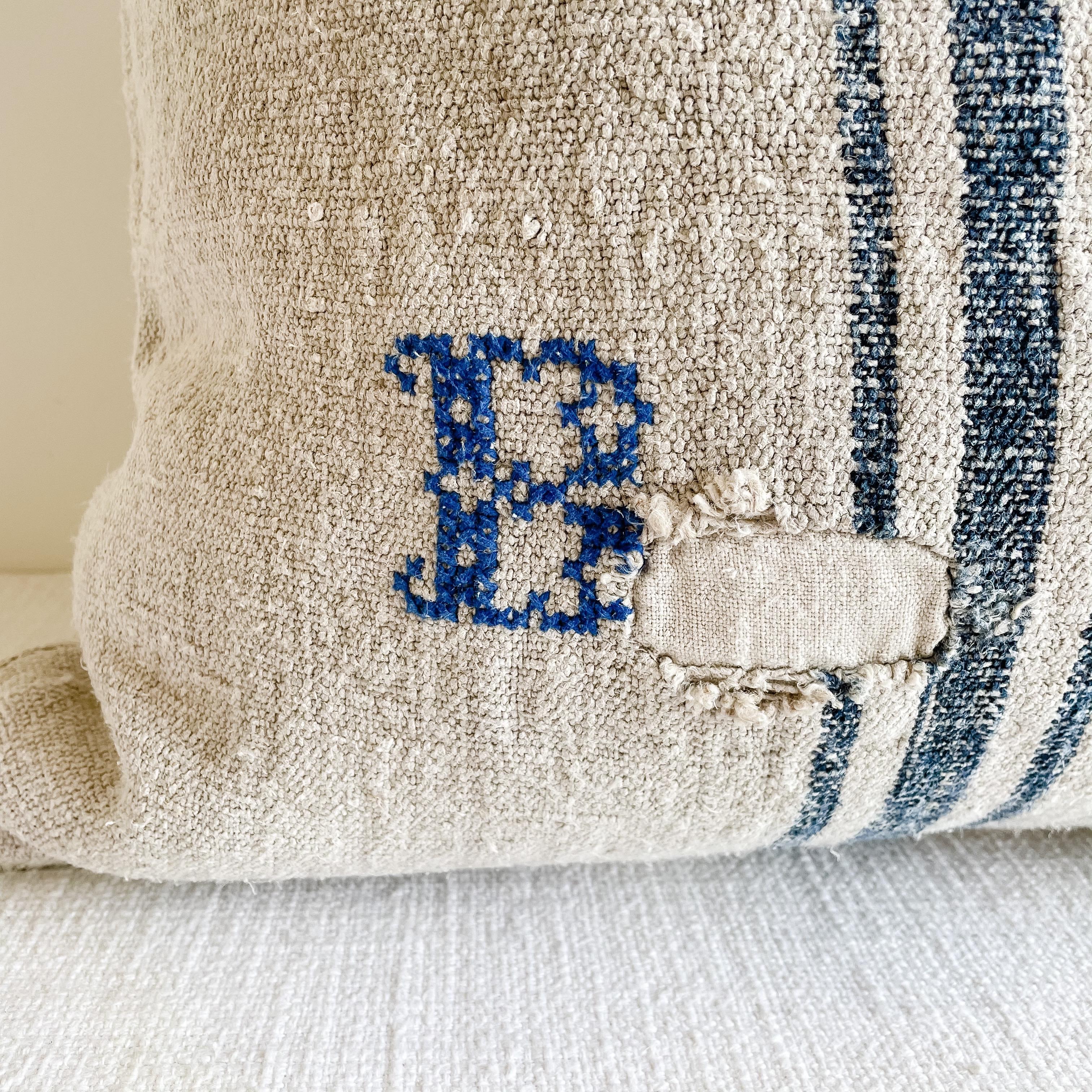 This beautiful vintage grainsack pillow is made from a European farmers grain bag with stripes, and original stipes, and some vintage grain sacks may show original patches or monograming. See photo details. 
 Our pillows are constructed with