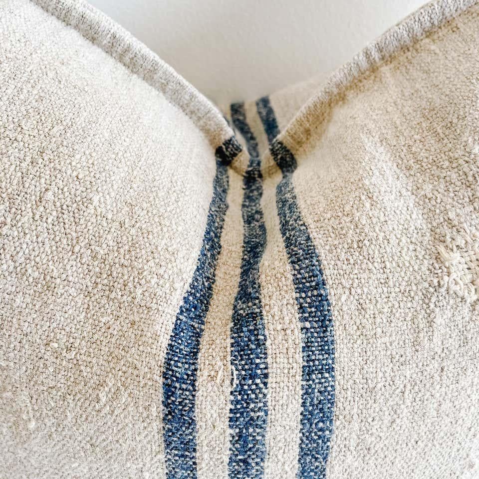 This beautiful vintage grainsack pillow is made from a European farmers grain bag with stripes, and original stipes, and some vintage grain sacks may show original patches or monograming. See photo details. 
 Our pillows are constructed with vintage
