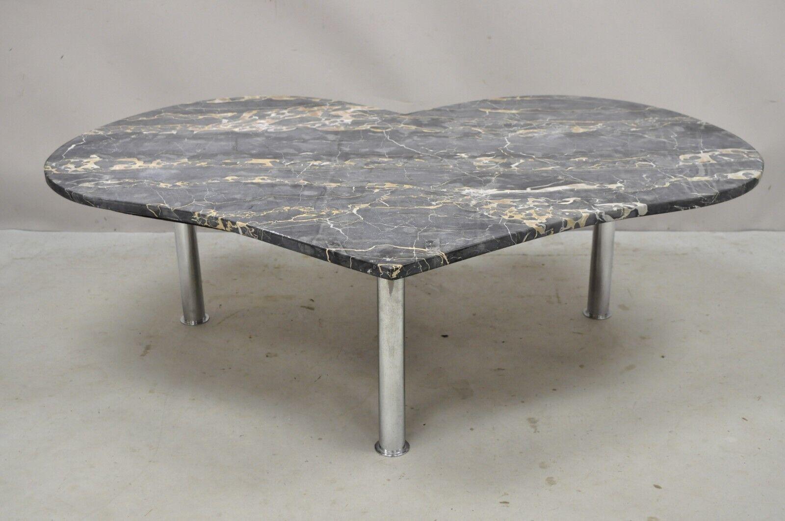Vintage custom made Italian marble top heart shaped coffee table. Item features a vintage custom made heart shaped Italian marble table top, chrome metal cylindrical legs, very nice vintage item, clean modernist lines, great style and form. Circa