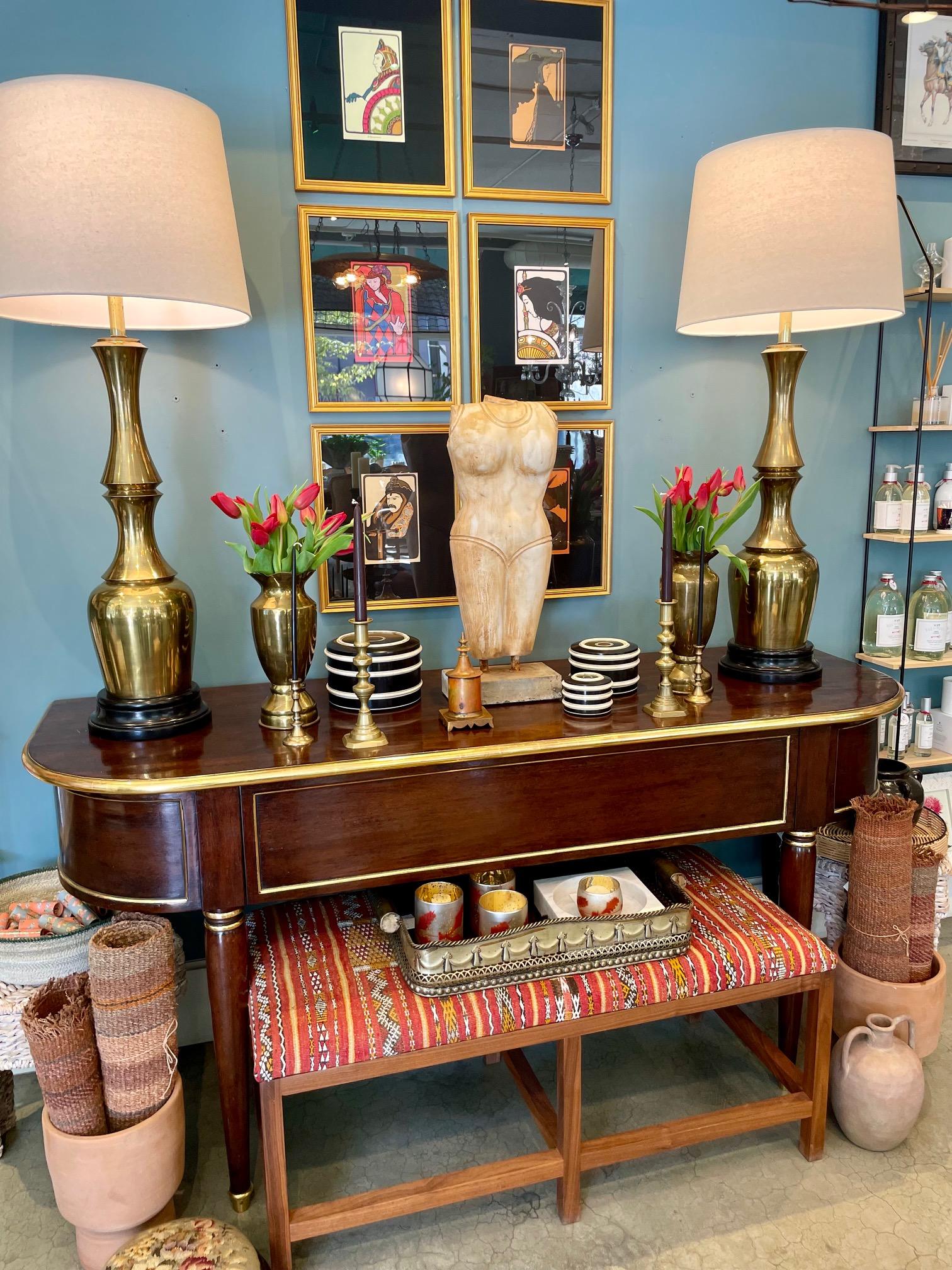 We are loving this handsome large vintage custom mahogany wood sideboard,  has 22KT gold leaf detailing, has a grand front center drawer for storage, beautiful rounded sides and has bold brass sabots (feet). It will dress up any wall or hallway,