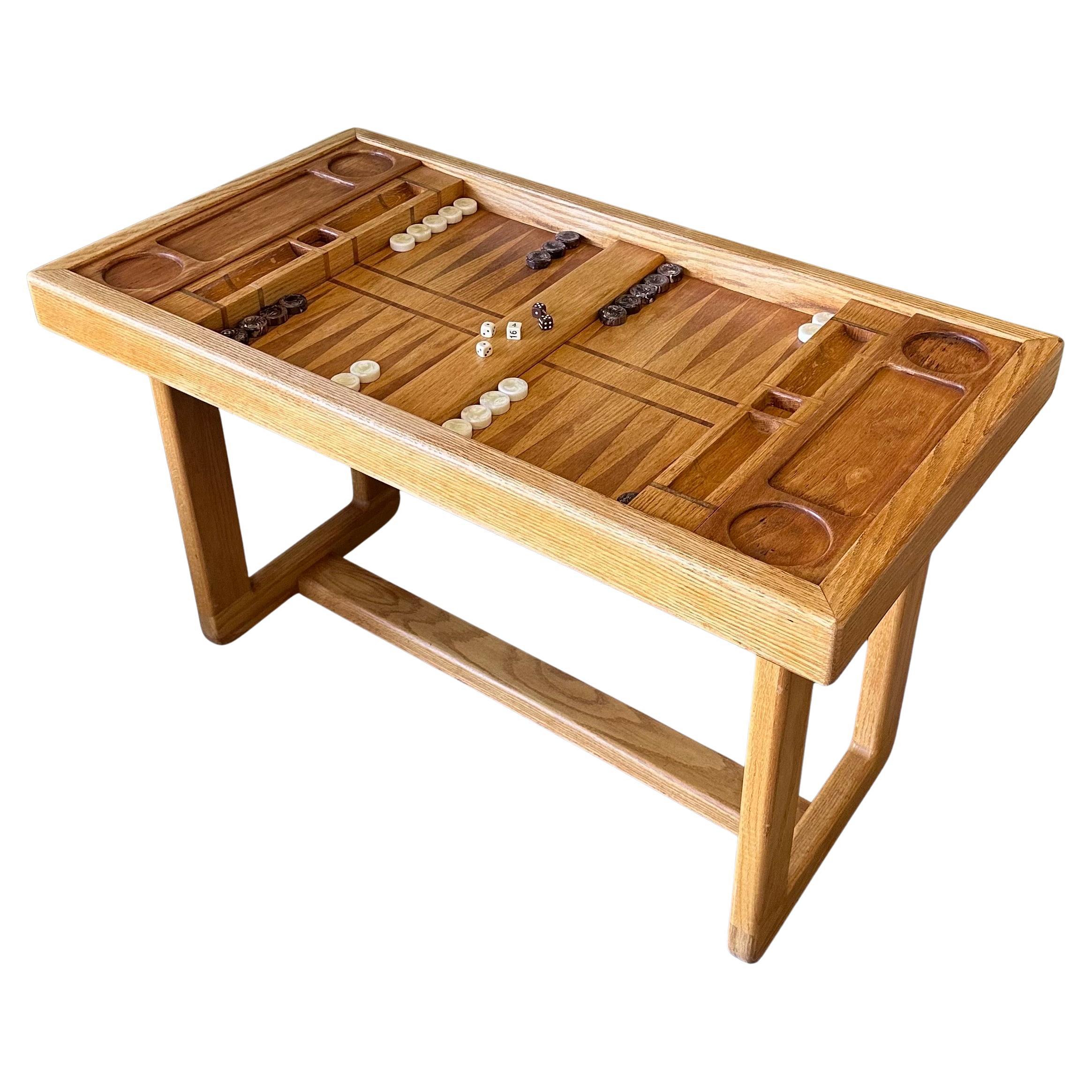 A super cool vintage custom made oak backgammon table with bakelite checkers, circa 1970s.  The table is in very good vintage condition and measures 47