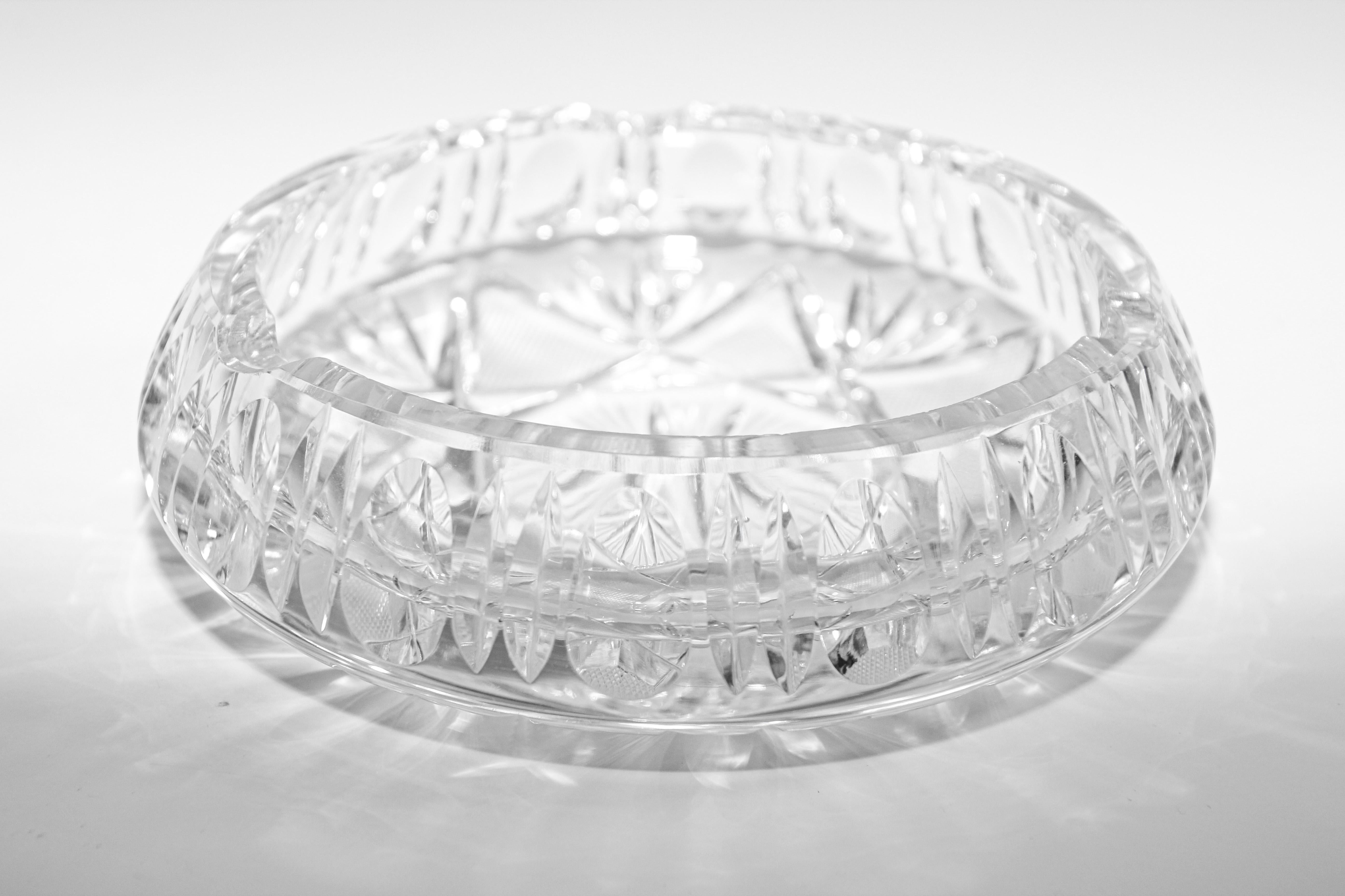Beautiful cut crystal clear glass ashtray decorated with a cut star design.
Wonderful fashionable glass multifaceted ashtray or decorative object
Heavy clear handcut etched crystal glass cigar ashtray.
The bottom of the bowl is gorgeous and
