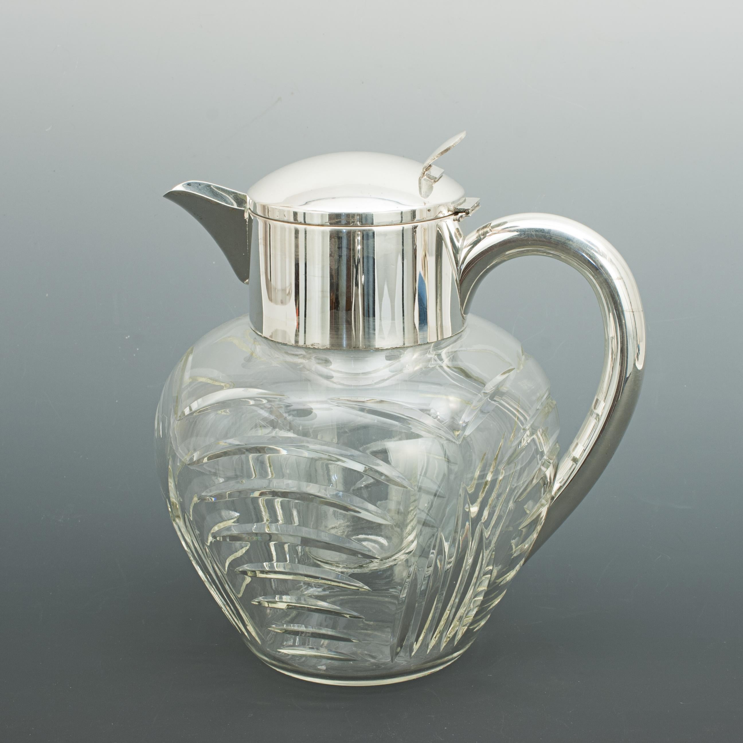 Vintage cut glass lemonade jug with cooler.
A very nice large lemonade jug with original internal cooling insert, this is the ideal way to keep your beverages chilled. The glass insert is filled with ice and put in place thus cooling the liquid