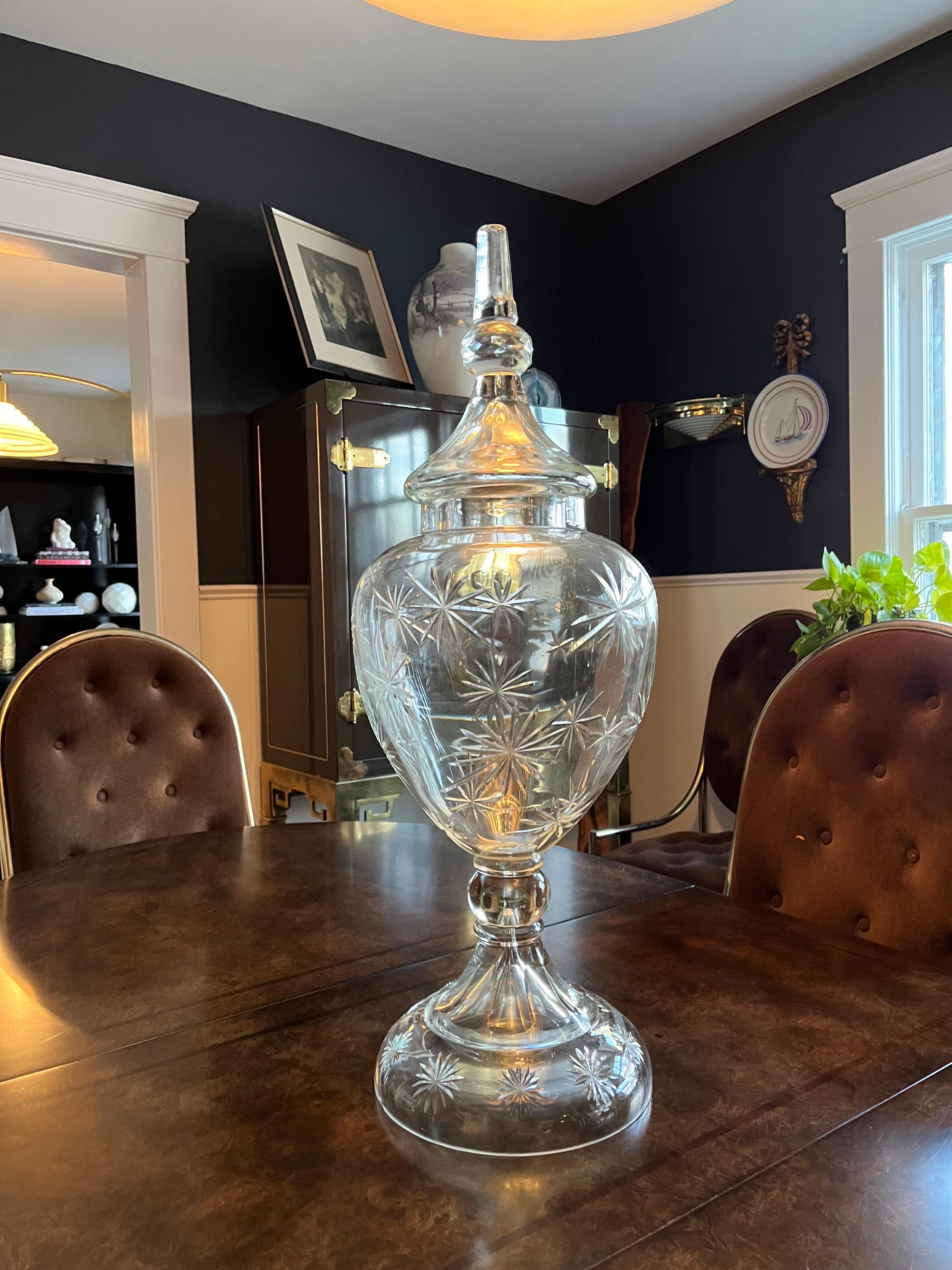 Beautiful cut glass or crystal lidded urn. Deep faceted starburst design. Very large and heavy. Thick glass with great visual. Many starbursts throughout the piece. 
Curbside delivery to NYC/Philly $400