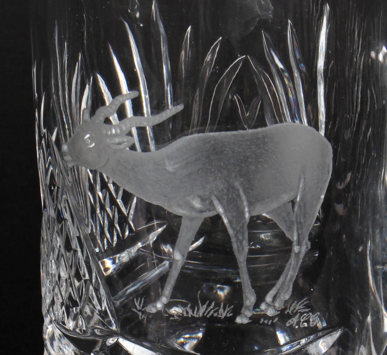 This is a splendid vintage engraved cut glass tankard, signed A.C.C and dating from the mid- 20th century.

This gorgeous tankard has a lovely engraved stag to the centre and distinctive cut glass geometrical motifs that resemble the concept of