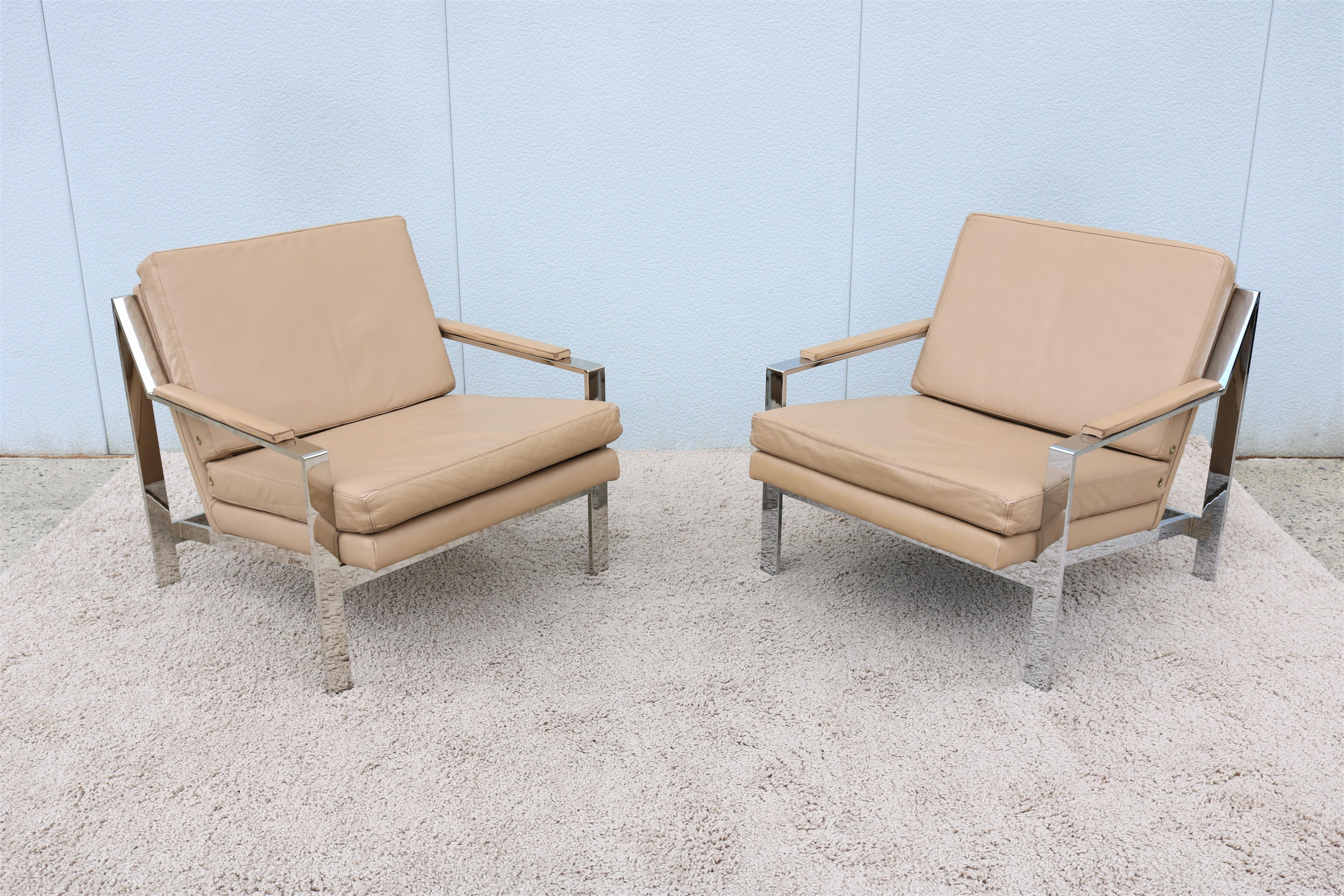 Stunning vintage pair of chrome and leather lounge chairs by Cy Mann in the style of Milo Baughman. 
This pair are upholstered in high quality aniline dyed Italian leather by Spinneybeck the world's leading supplier of quality leather.
Iconic and