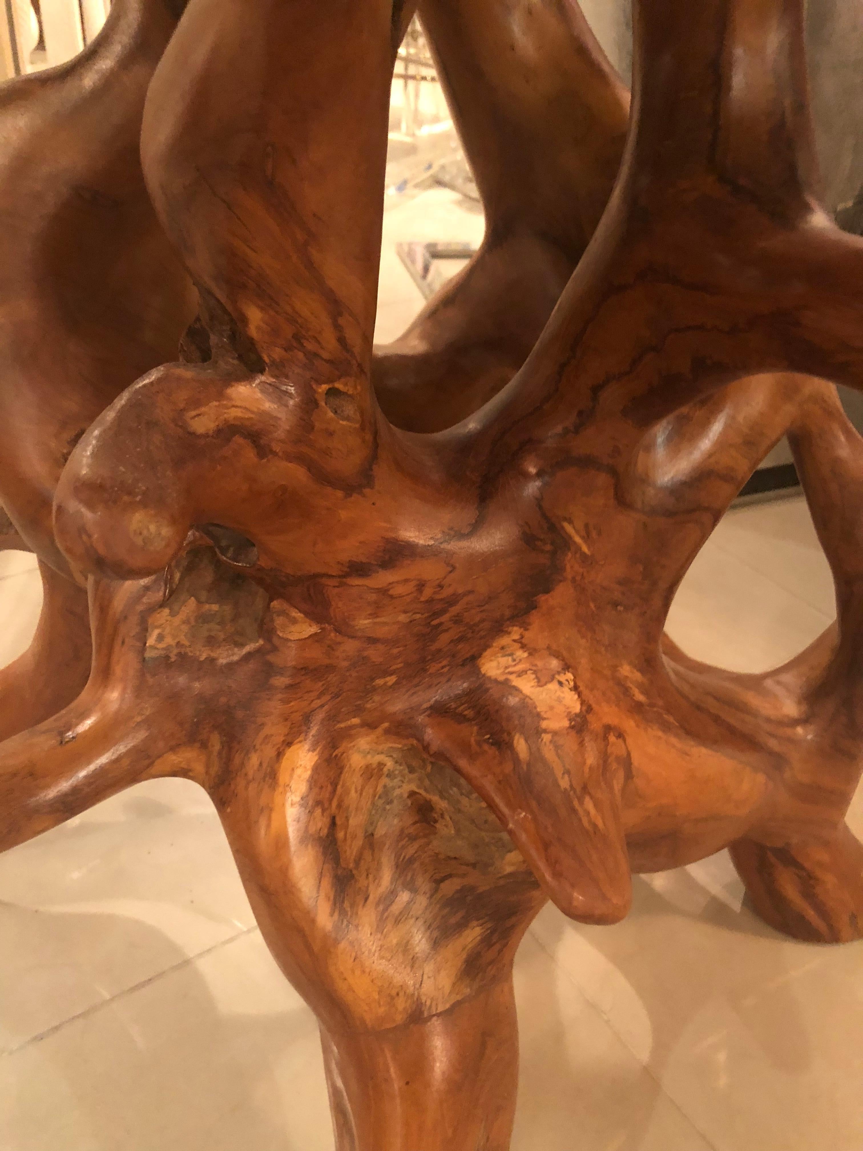 Such an amazing vintage cypress trunk, free-form table base. This can be used as is or can be topped with a piece of glass. Each view of this table offers a different perspective of the natural design. The rich, warm colors are an added touch.