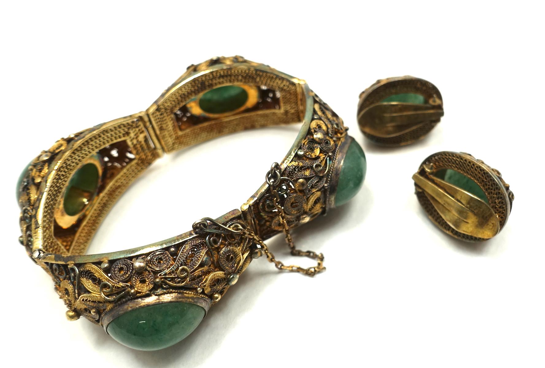 gold bracelet with green stone