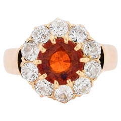 Vintage Daisy Ring in 14-Carat Gold, Spessartite Garnet and Diamonds.