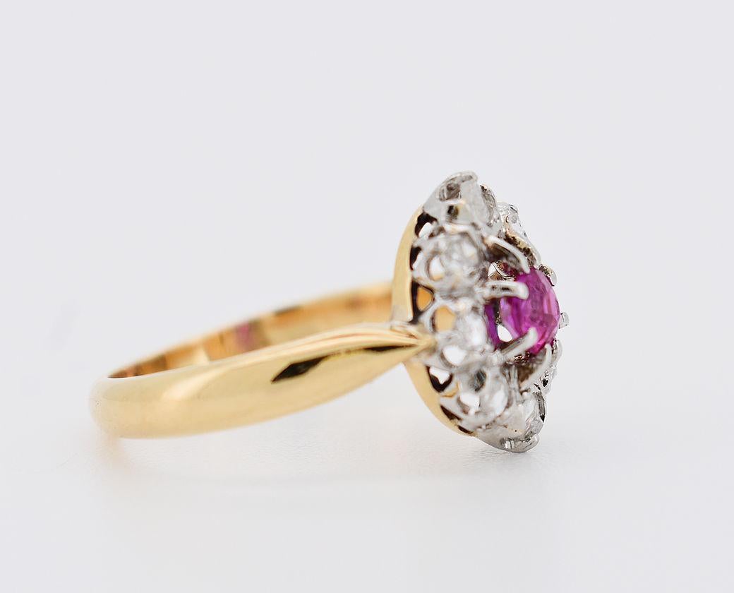 Vintage Daisy Ring (circa 1900) in 18K Yellow Gold (750mm). It is set in the center with a natural ruby of approximately 0.10 carat, surrounded by rose-cut diamonds totaling approximately 0.20 carat.

Detailed Characteristics:

Weight : 3.4 g
Size :