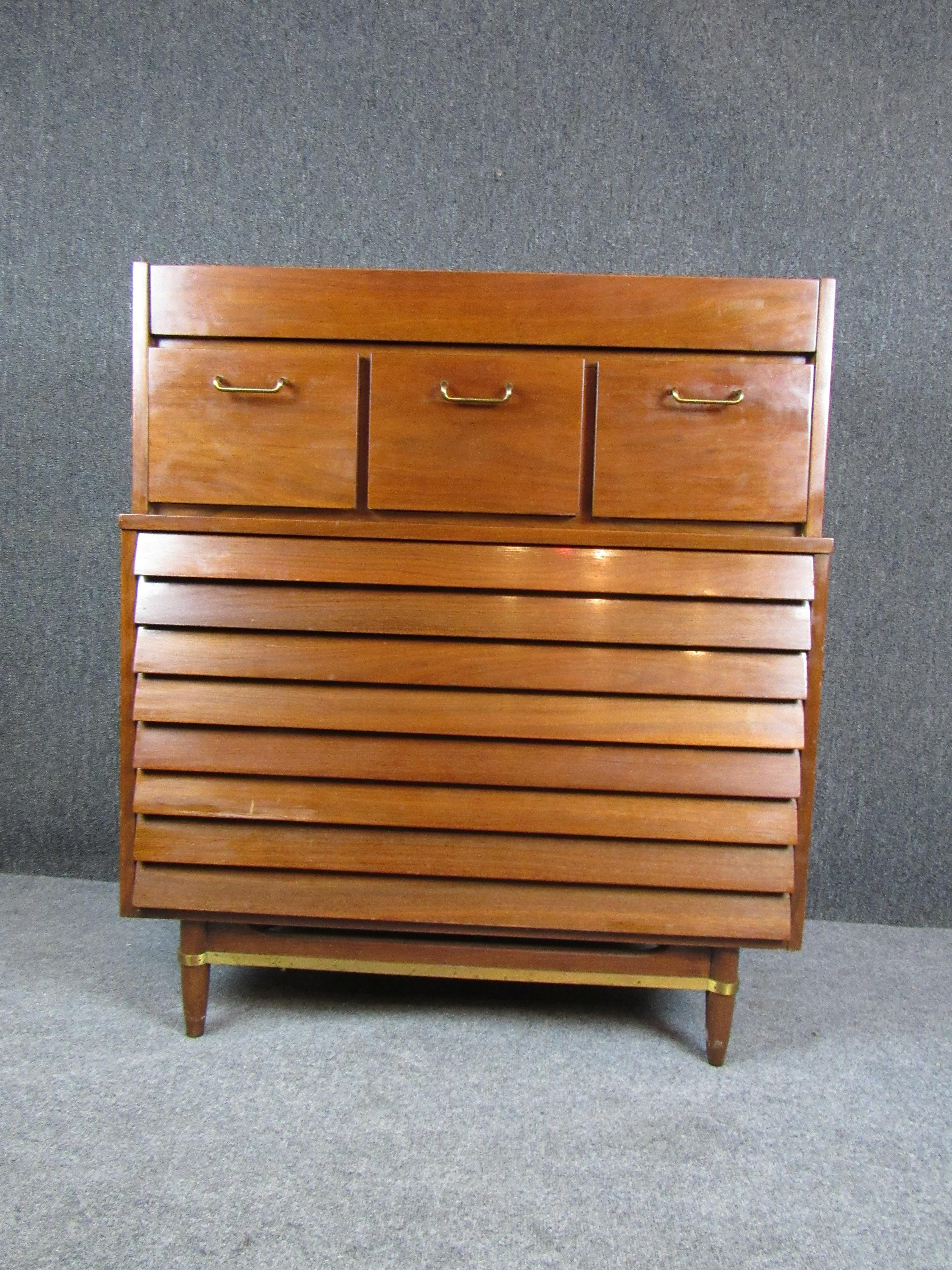 Bring home a tremendous example of authentic Mid-Century Modern furniture with this stunning dresser designed by the legendary Merton Gershun for the famed American of Martinsville furniture company. Built by genuine American craftsmen in the