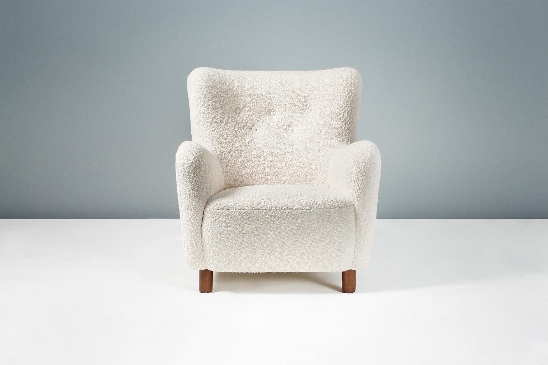 Danish cabinetmaker 

Lounge chair, 1954

Armchair in the manner of Fritz Hansen, produced in Denmark and distributed by FDB Mobler. Stained beech legs with new cotton-wool blend boucle wool fabric upholstery. 

Measures: H 73cm / D 68cm / W