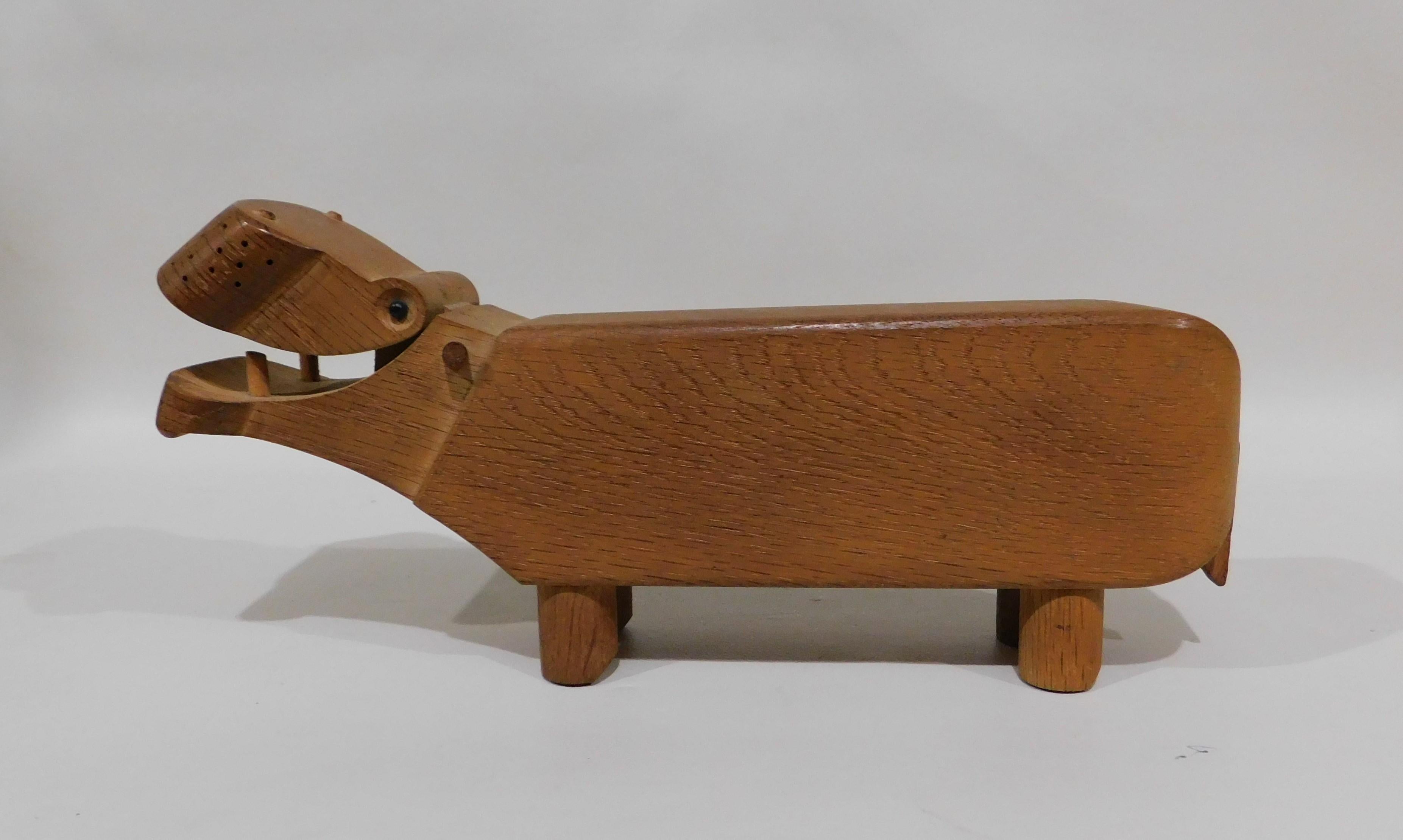 Mid-Century Modern Kay Bojesen designed the Hippopotamus in 1955 because he needed a device to store his pencil's. The hippo is made of oak and features an adjustable jaw allowing you to hold your pencil or pen. It is stamped on the bottom Kay