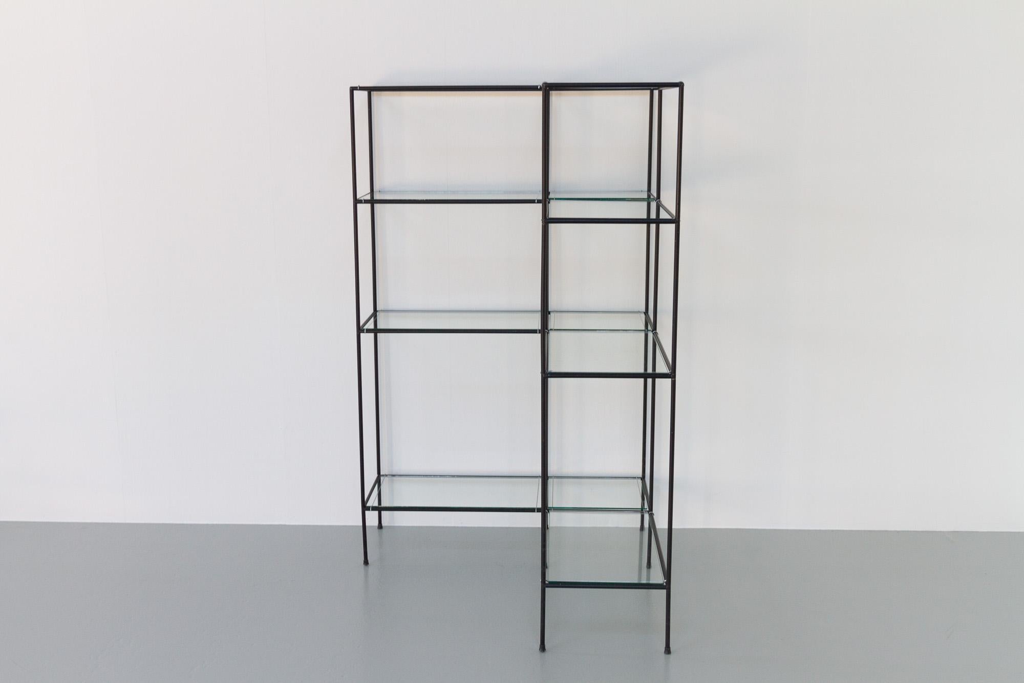 Vintage Danish Abstracta corner bookcase by Poul Cadovius, 1960s.

Mid-Century Modern minimalistic shelving unit system Abstracta, Denmark designed in 1962 by Danish architect Poul Cadovius. He was also known for designing the very popular wall