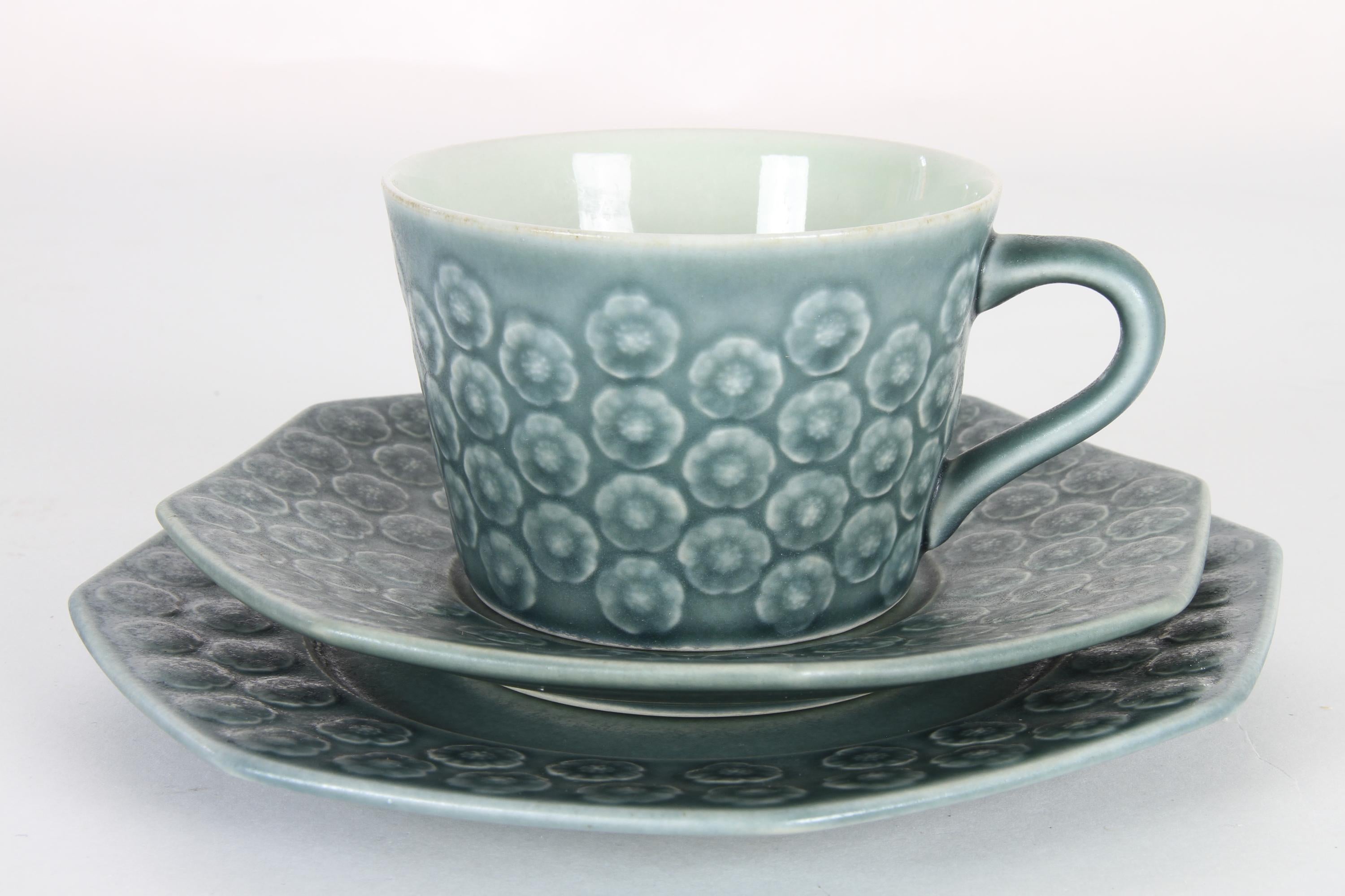 Vintage Danish Azur coffee/tea service trio by Jens H. Quistgaard for Kronjyden.
This beautiful Mid-Century Modern stoneware set by IHQ consists of a cup, a saucer and a side plate. Very lovely delicate flower pattern in the color azur, hence the