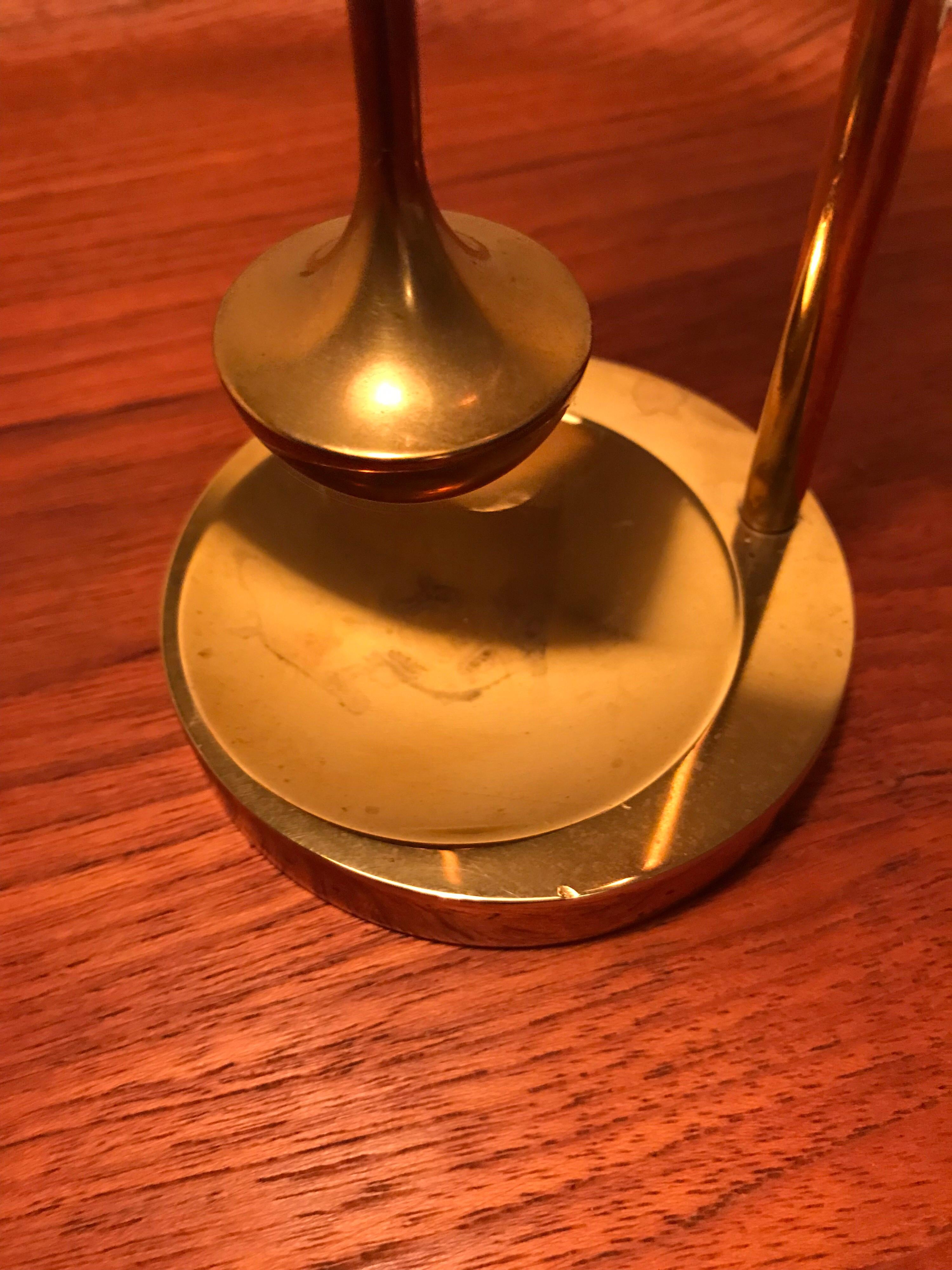 Vintage brass oil lamp handmade in Denmark and designed by Ilse Ammonsen 
Adjustable height and a self leveling gyro function 
Engraved on the base “Ilse Ammonsen”.
 