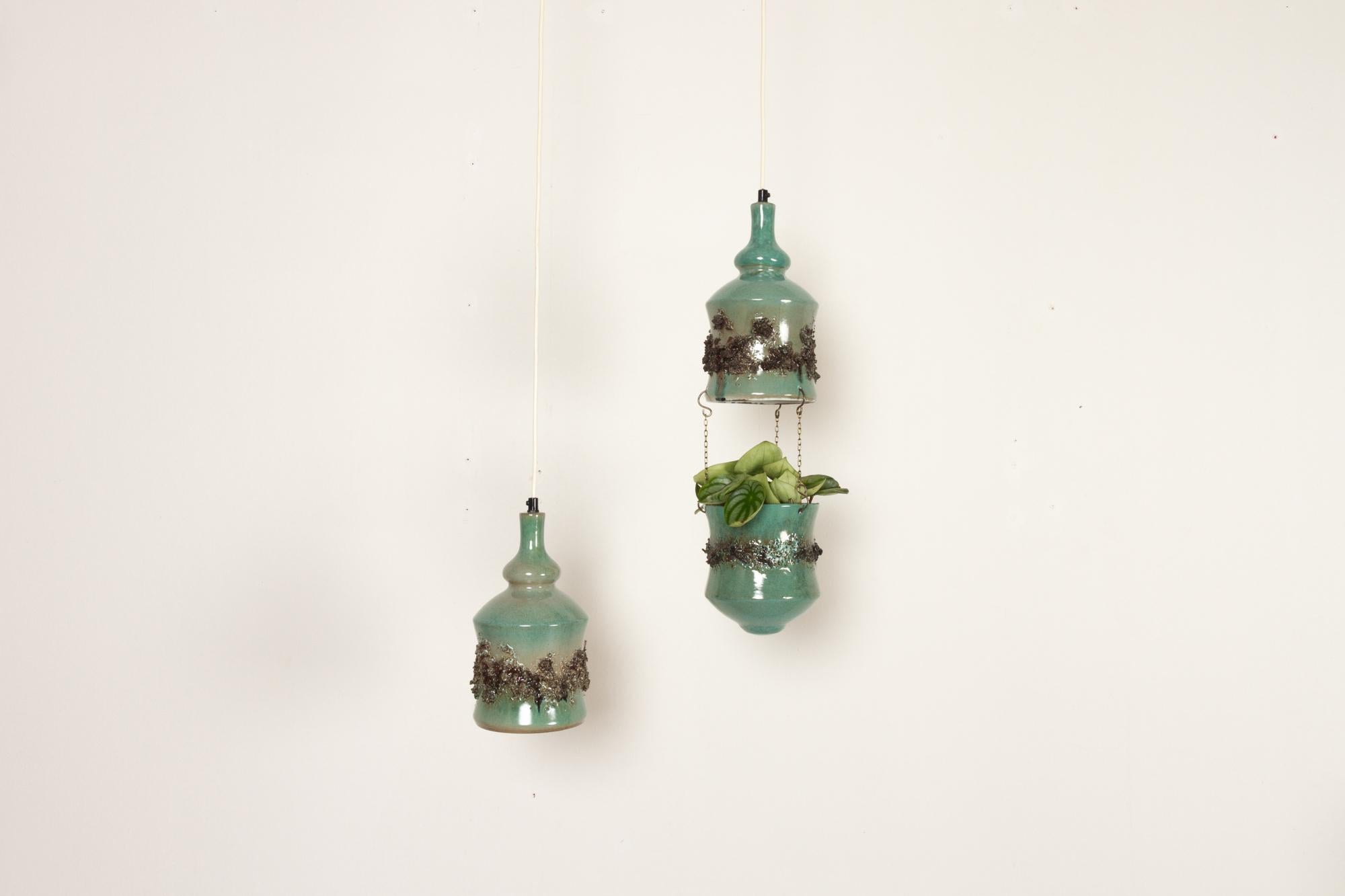 Vintage Danish ceramic pendants and hanging flower pot 1960s 
Danish mid-century modern ceramic lamps in light green glaze. One lamp has a matching flower pot suspended in brass chains. Inside of lamp and flower has a white glaze.
E26/27 socket.