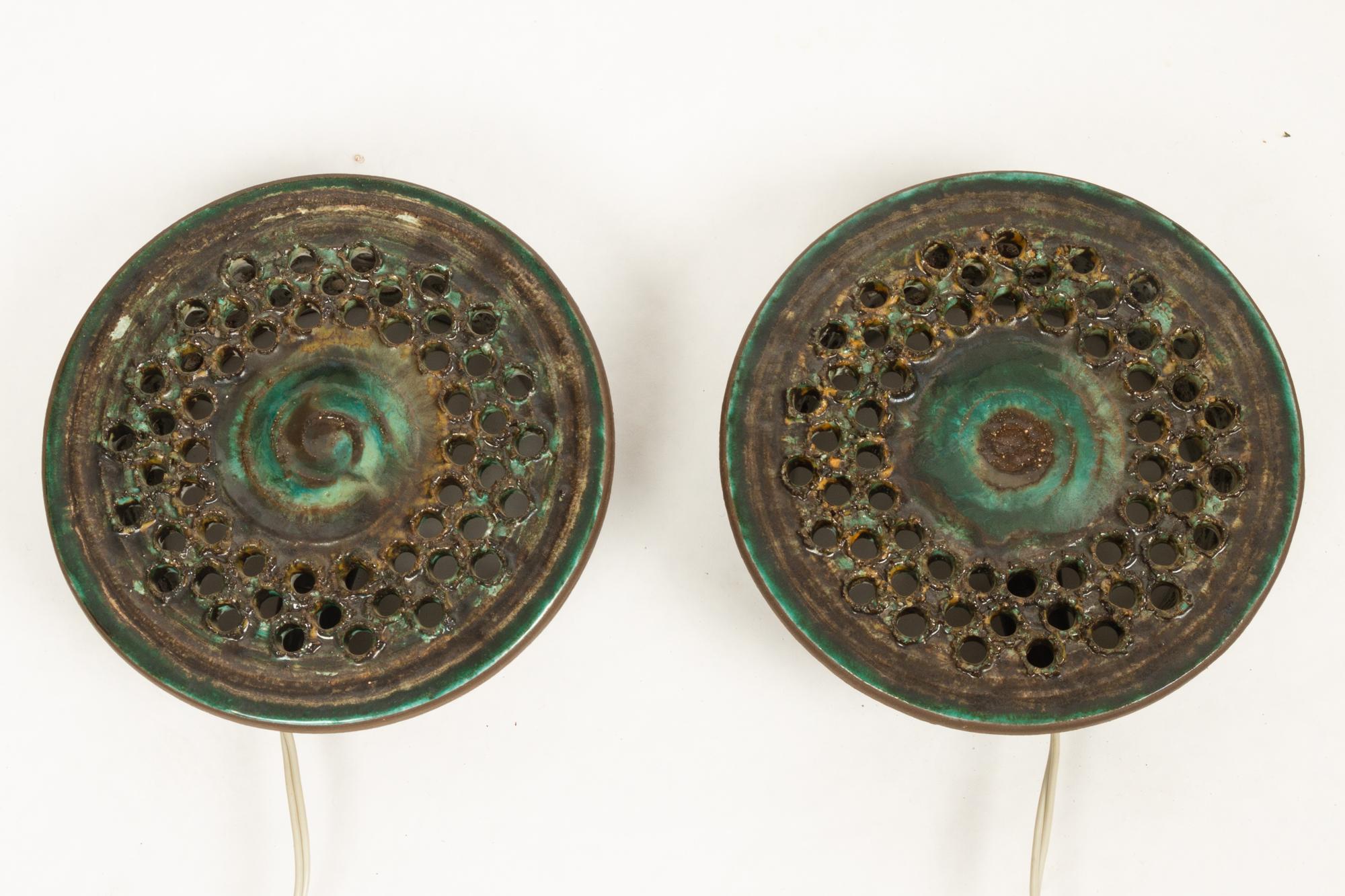 Vintage Danish ceramic sconces, 1960s, set of 2.
Pair of beautiful handmade ceramic wall lights by Danish ceramist Ib Oluf Hansen for Demstrup Keramik. Green and brown glazing.
Lamps stamped: Ib O. Demstrup DK 28-7-1975.
Very good condition,