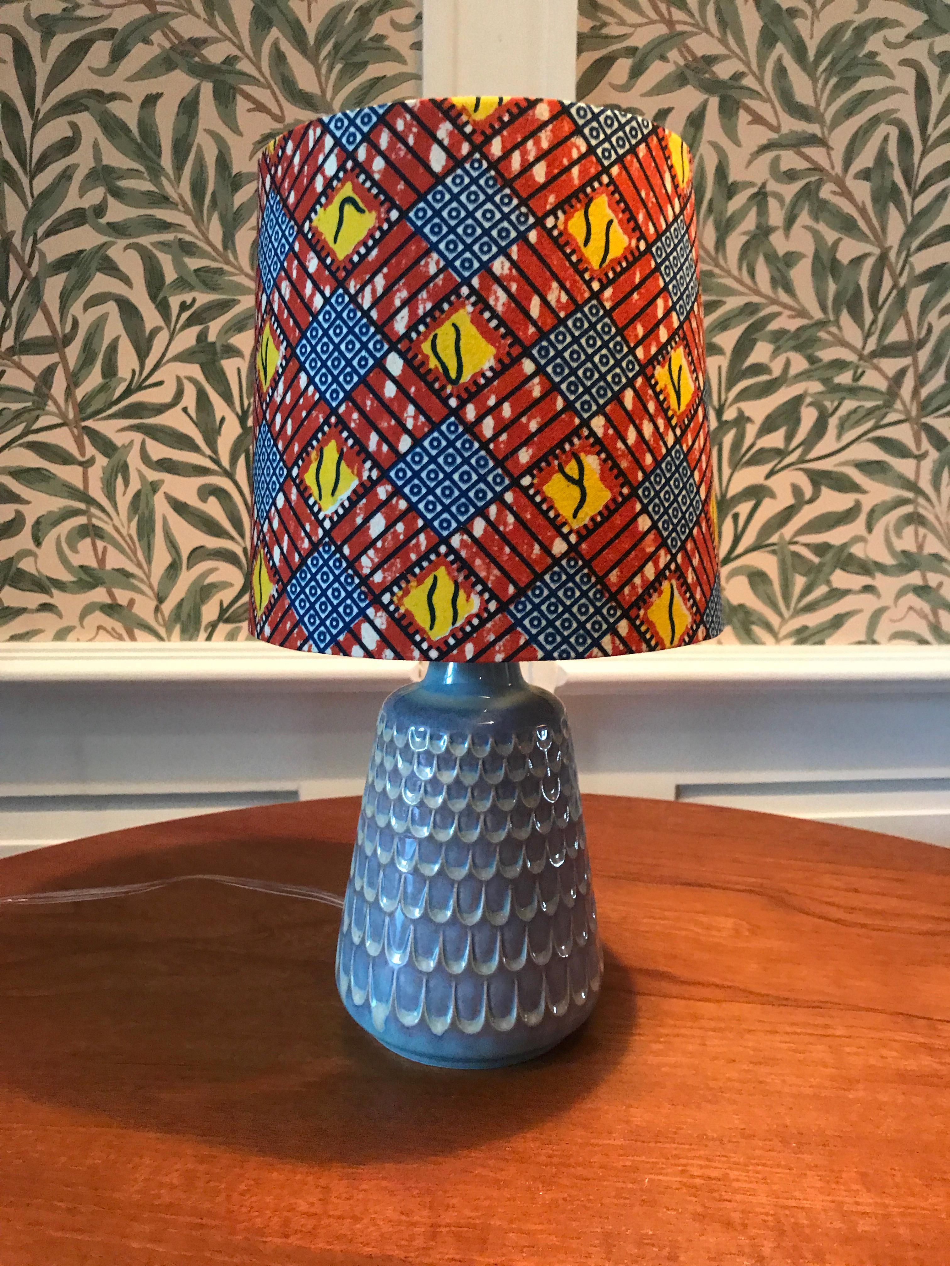 Lovely ceramic table lamp in grey-green glaze. New lampshade in beautifully patterned African textile.