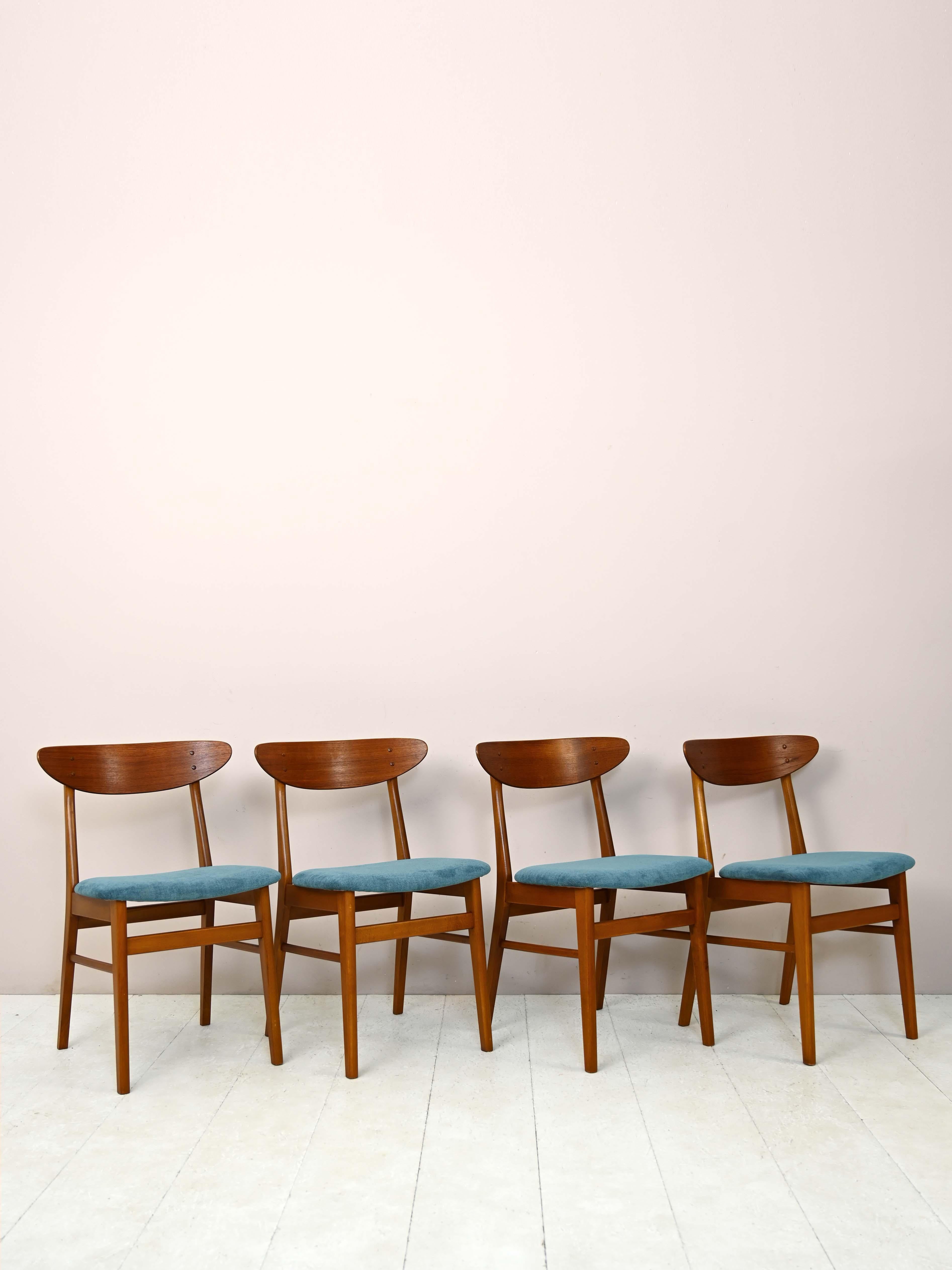 Set of 4 wooden chairs from the 1960s.

Original Scandinavian chairs with simple and elegant lines. Consisting of teak wood frame, they are distinguished by the contoured shape of the backrest. The seat is upholstered and reupholstered with teal