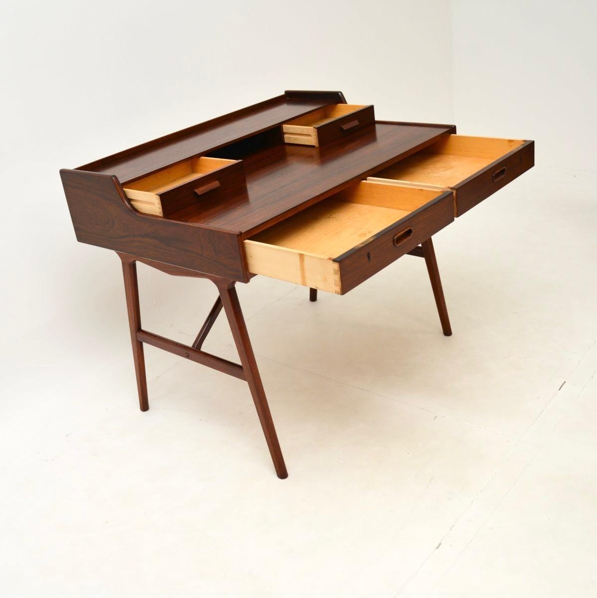 An absolutely stunning vintage Danish desk by Arne Wahl Iversen. It was made in Denmark by Vinde Mobelfabrik, it dates from the 1960’s.

The quality is outstanding, this has beautiful and very practical design. The grain patterns and colour tones