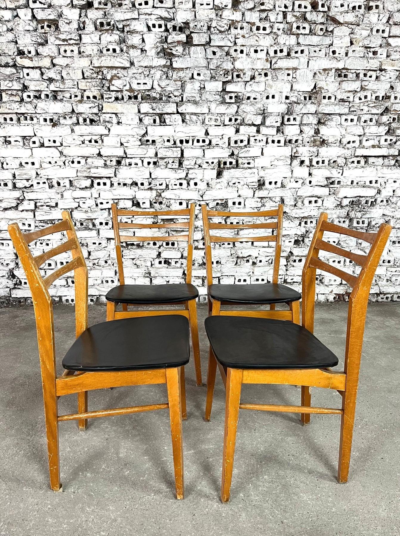 Dimensions: H 31.8” x W 16.9” x SD 15.7” x SH 17.3”

Set of 4 Vintage Danish dining chairs from 1960s. in teak wood and black skai seats. The seat backs are ladder-back style and have slight curve to them

Please see our other listings for ideas and