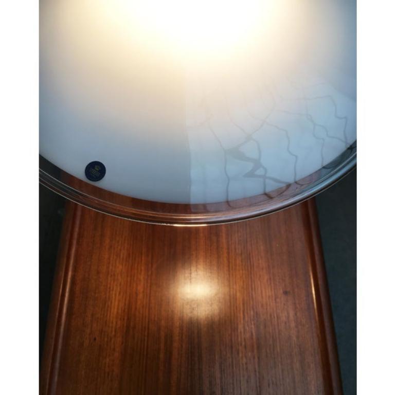 Ornamental glass pendant light from Danish manufacturer Royal Copenhagen / Holmegaard and designed by Michael Bang from the 70s.

a rotational body made of opal glass is used as a diffuser with distinctive bulges. The glass is made clear on the edge