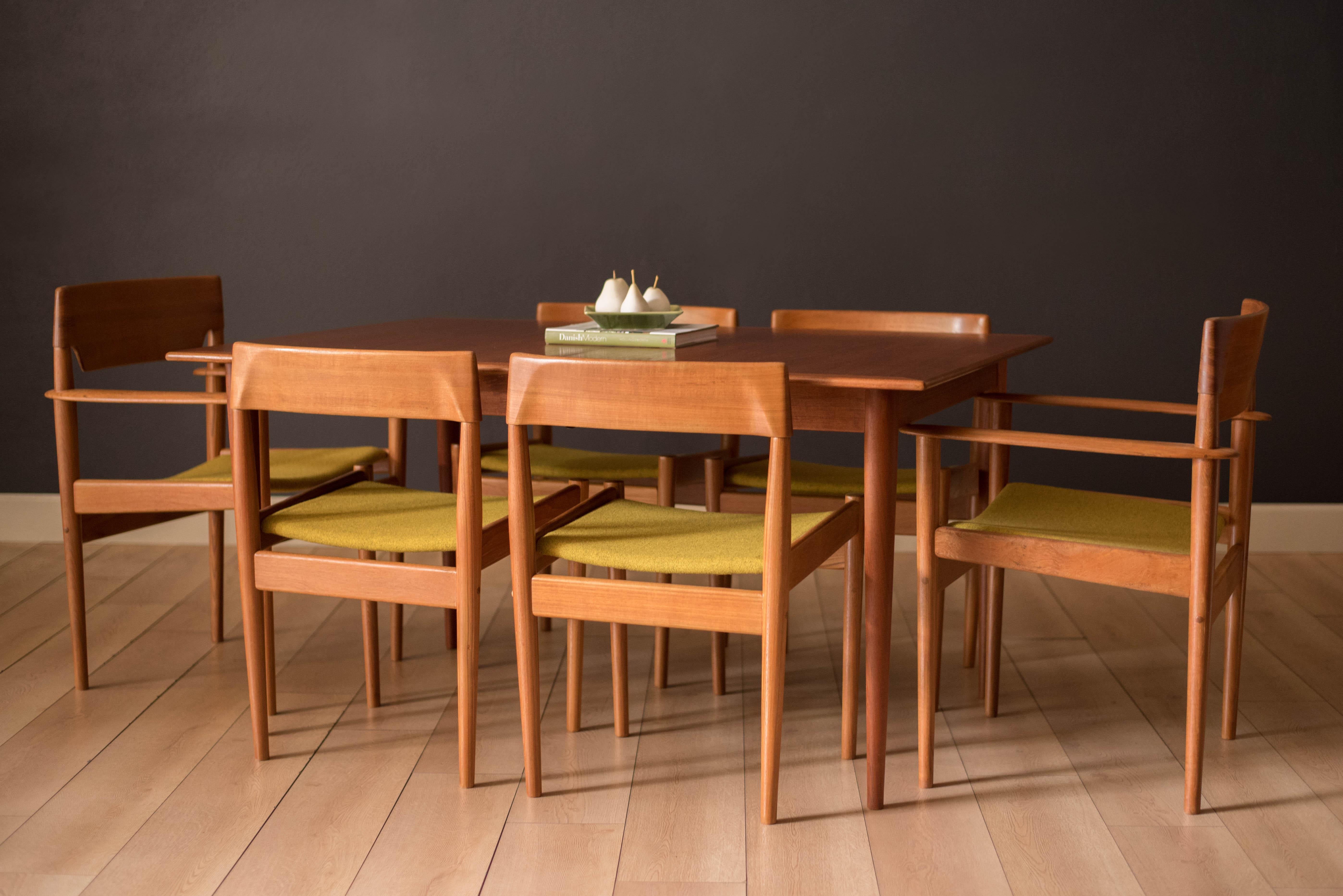 Mid-Century Modern extension dining table designed by Grete Jalk for Poul Jeppesen, Denmark circa 1960's. This piece is constructed with true craftsmanship featuring opposing vertical teak grains and picture frame edge banding within each table