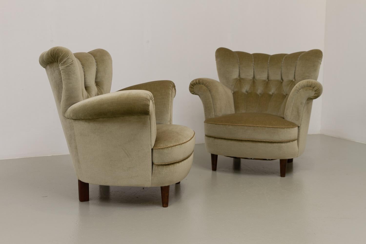 Vintage Danish Green Velvet Wingback Lounge Chairs, 1940s. Set of 2. 

Pair of Danish Mid-Century Modern high back lounge chairs in light sage green velour made by Danish cabinetmaker in Denmark in the 1940s in the style of Fritz Hansen or Alfred