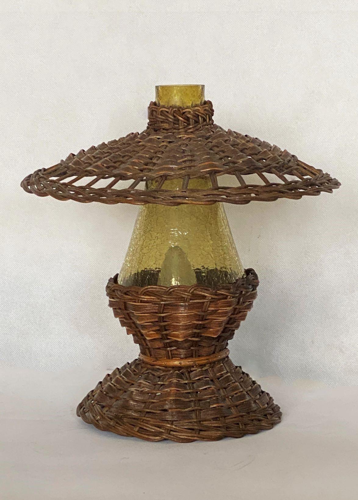 A lovely true Vintage Handcrafted rattan table lamp, Denmark, 1960s, with a colored hurricane glass shade. It takes one Edison E14/E12 screw bulb. This beautiful lamp is in fine vintage condition, no damages, rewired.
Measures: Diameter 10