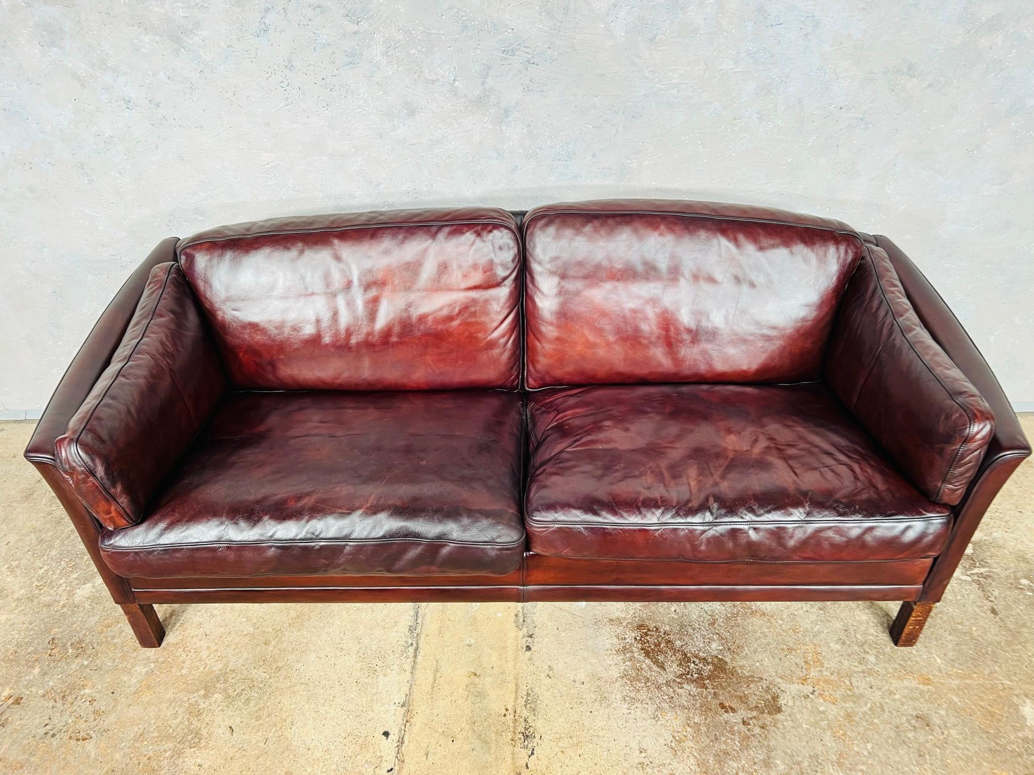 A Stylish Danish 1970s Sofa designed by Mogens Hansen, great design with beautiful lines, sits wonderfully. This is a 2.5 seater or a large two seater.

The sofa has a Stunning hand dyed deep chestnut colour, the leather has a great patina and