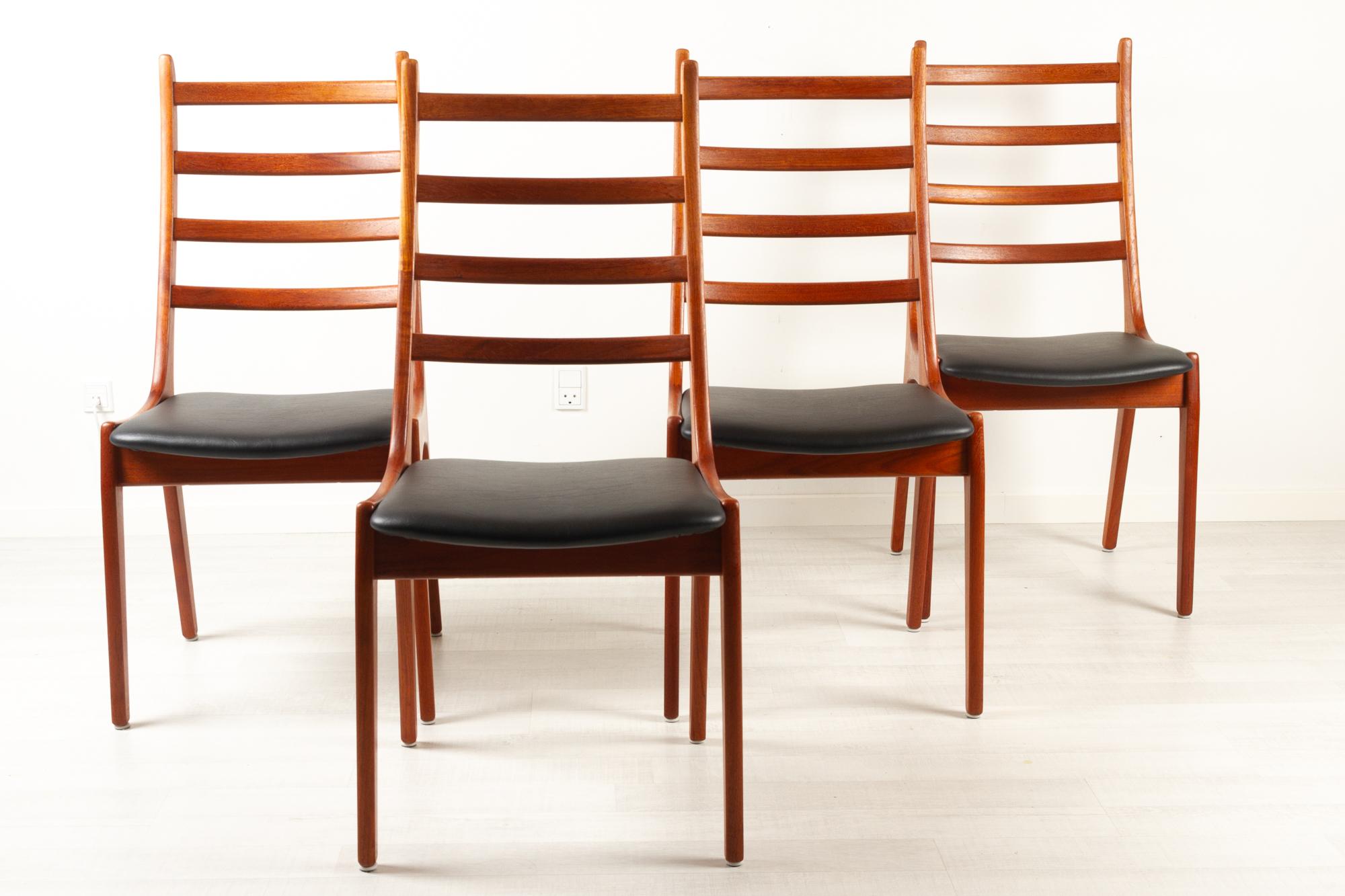 Vintage Danish teak dining chairs by Korup Stolefabrik 1960s, Set of 4.
Set of Danish Mid-Century Modern ladder back dining chairs in solid teak with new upholstery in black faux leather and high density foam. 
Beautifully sculpted chairs with