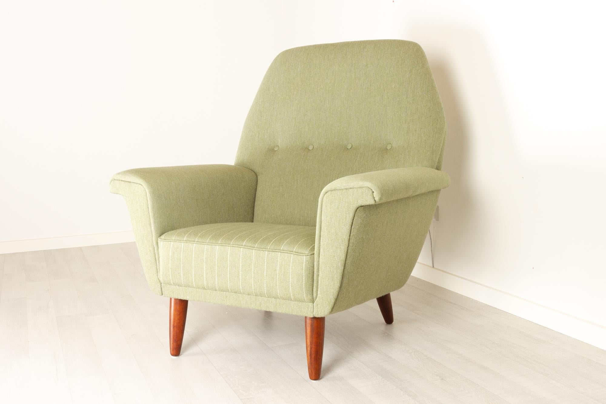 Vintage Danish Highback lounge chair by G. Thams for Vejen Polstermøbelfabrik, 1960s.
Model 53 designed in the early 1960s by Danish architect Georg Thams. Mid-Century Modern high back lounge chair in light green wool upholstery. Seat has a fixed