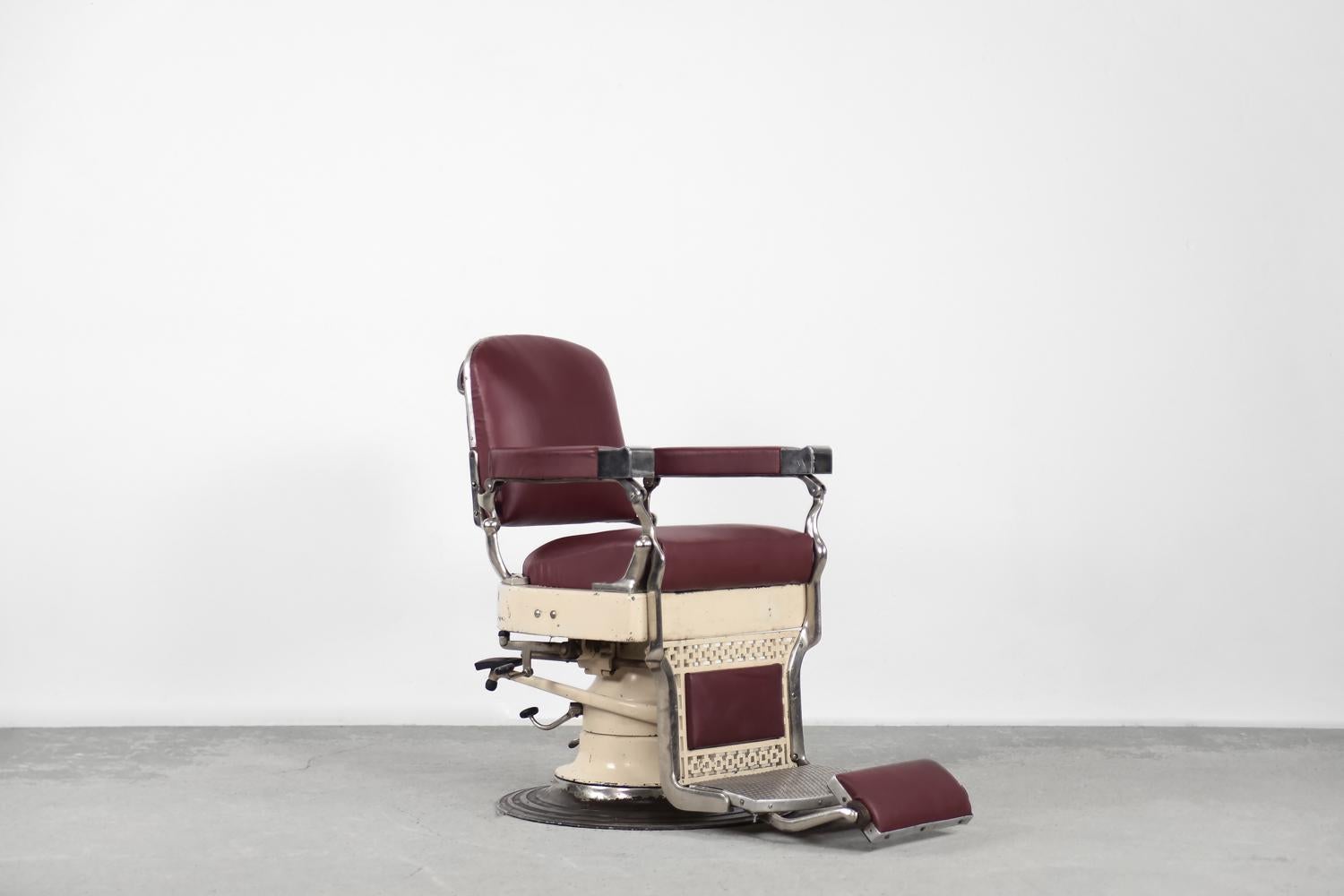 This antique dental chair was produced in Denmark at the turn of the 1920s and 1930s. It is marked with the Axel Christensen Aarhus signature. The seat is swiveling and is raised with a double clutch and lowered with an oil level control. It uses
