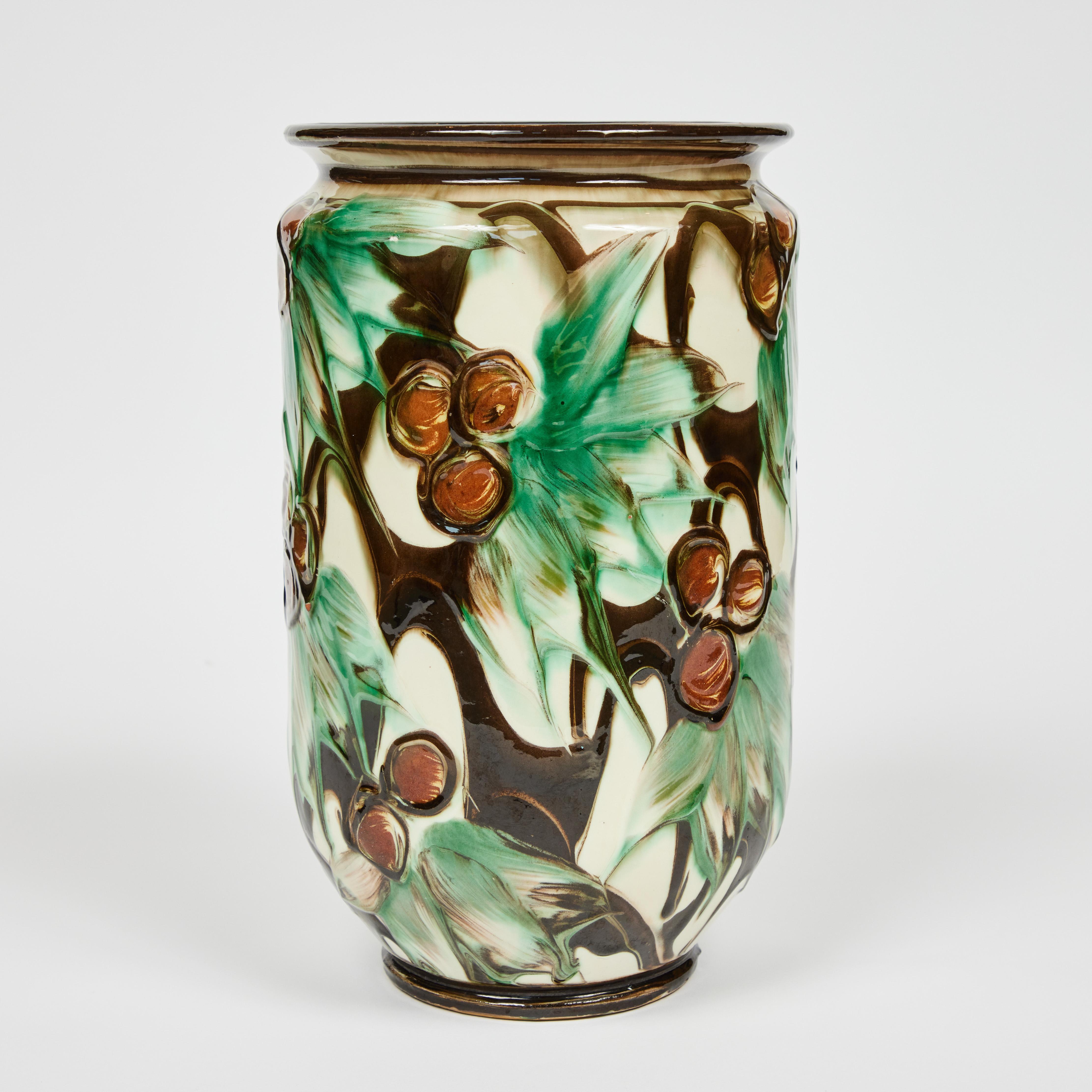 Herman Kahler HAK Denmark

Slight abstract pattern of leaves + berries in a green, brown and cream glaze.