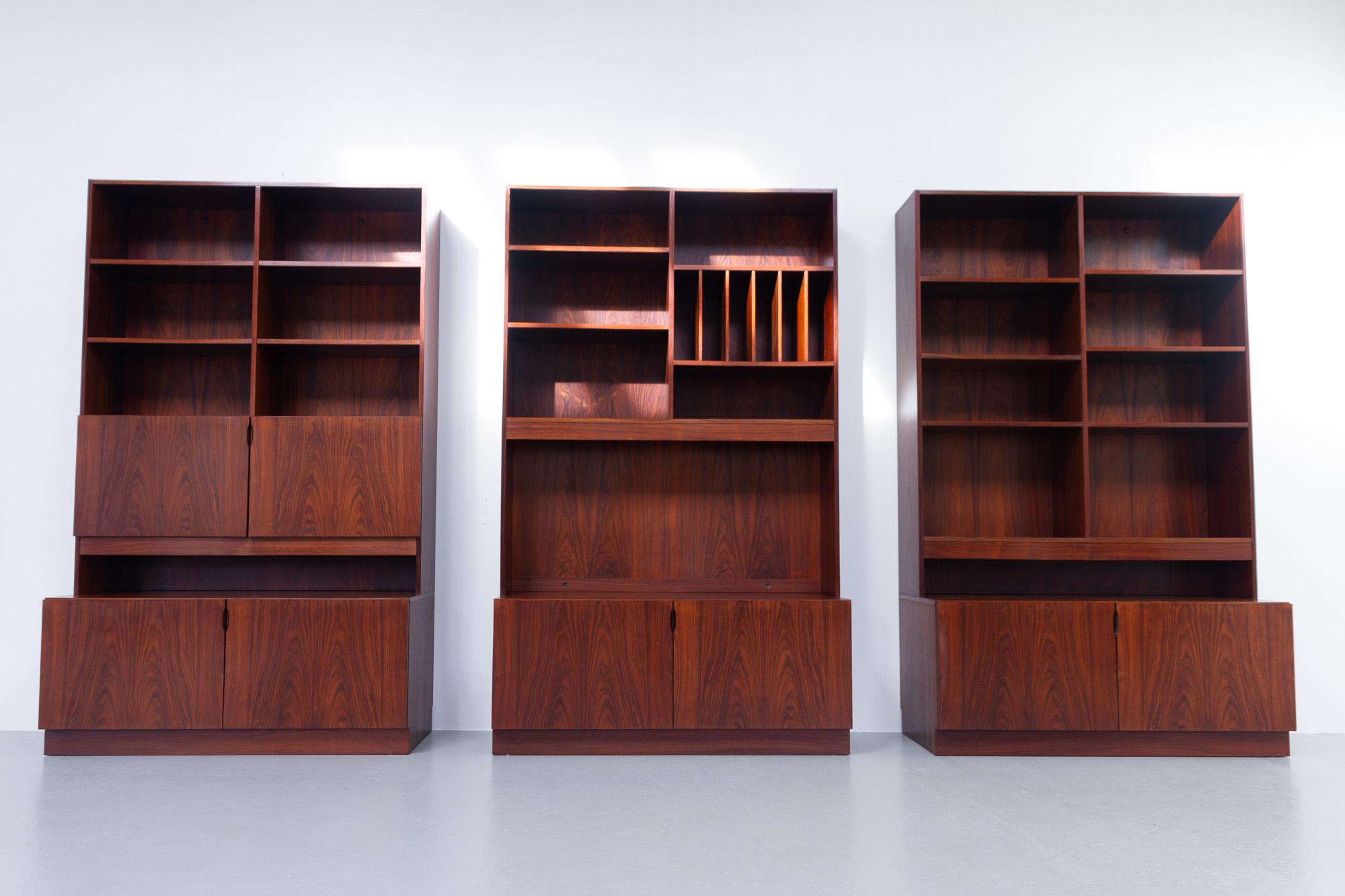 Vintage Danish large rosewood bookcase, 1960s.
Large and impressive Scandinavian Modern 3 bay bookcase in stunning Rosewood veneer. This three part Danish library with plenty of storage space can be used as one large unit or three separate units.