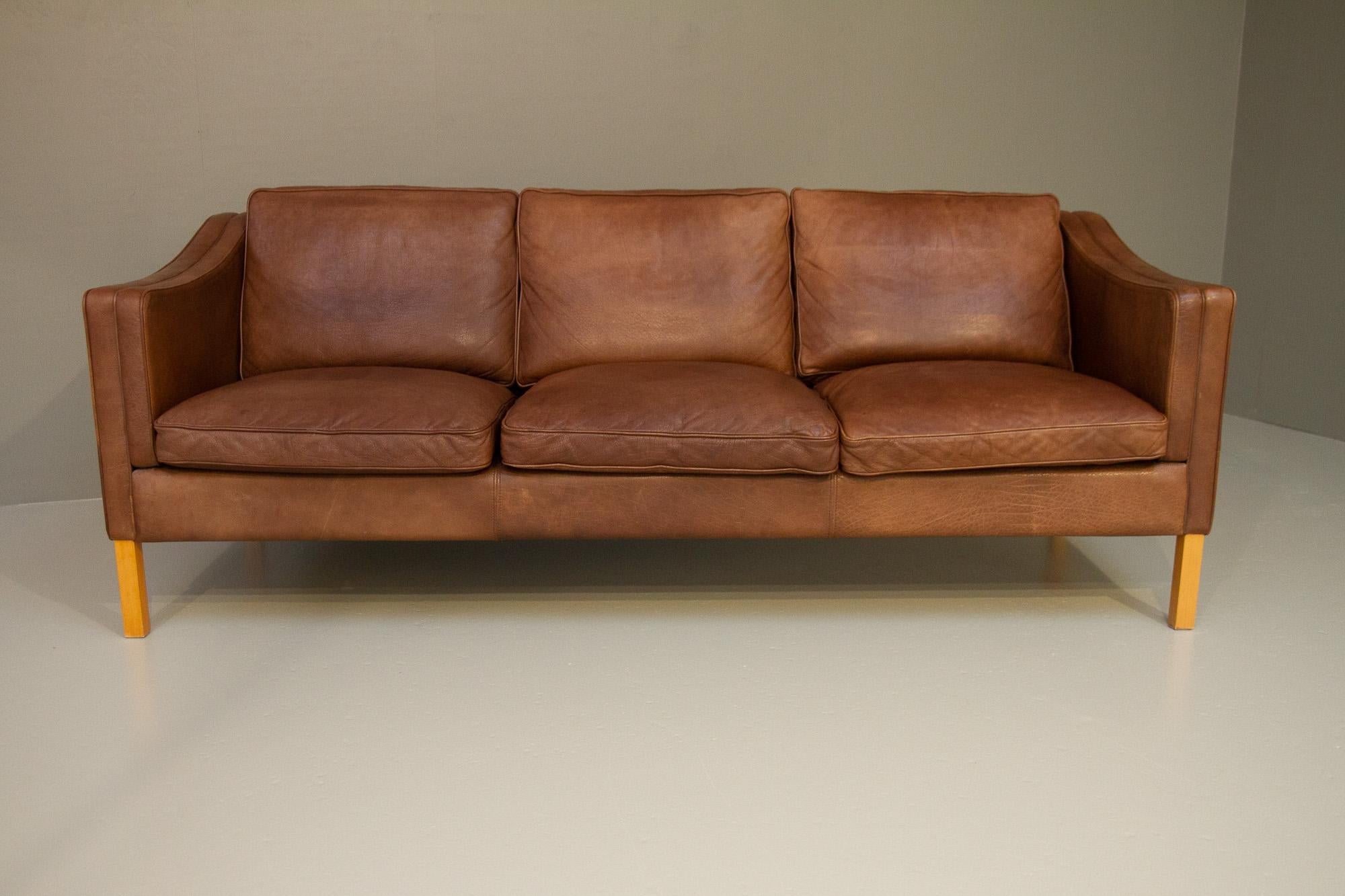 Vintage Danish Leather 3-Seater Sofa by Stouby, 1980s.
This type of iconic Danish sofa was first designed by Børge Mogensen in the sixties for his own house so he had a place to rest. The last photo shows the Danish designer Børge Mogensen in his
