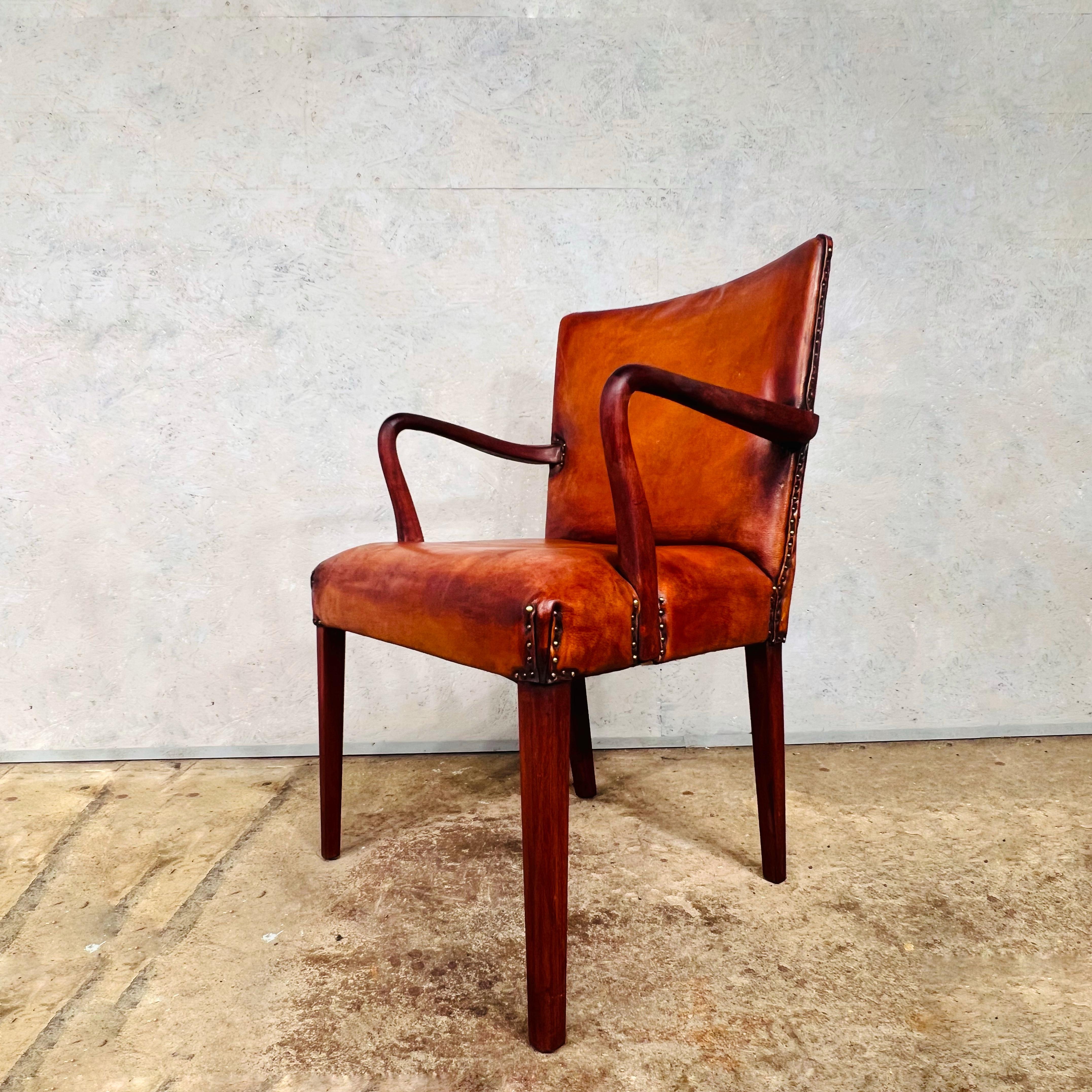 Vintage Danish leather desk chair with a solid teak frame in Cognac
Lovely and sleek design, beautiful patinated Cognac coloured leather, hand dyed with a beautiful finish. 

Beautiful Teak Frame.

In great condition.

Viewings welcome at our
