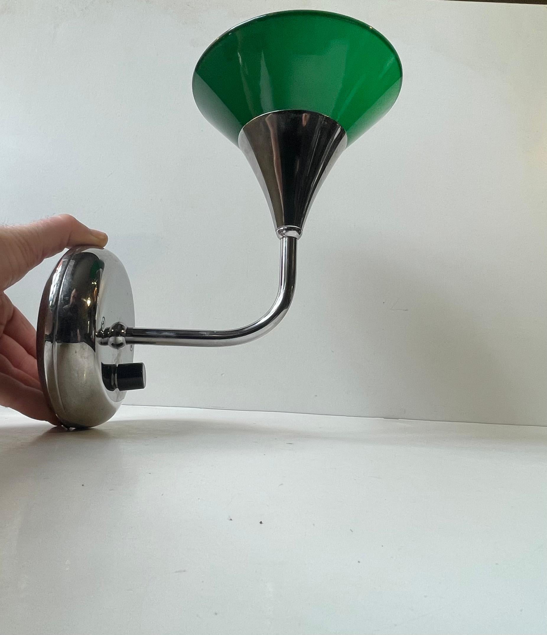 Chrome-plated up-light wall lamp with green shade in cased glass. Made by Happy Light in Denmark during the 1980s. 

Measurements: H: 21 cm, Dept: 27 cm, Diameter: 17 cm (shade).

For the US. It will come installed with a 110 watt adaptor plug ready
