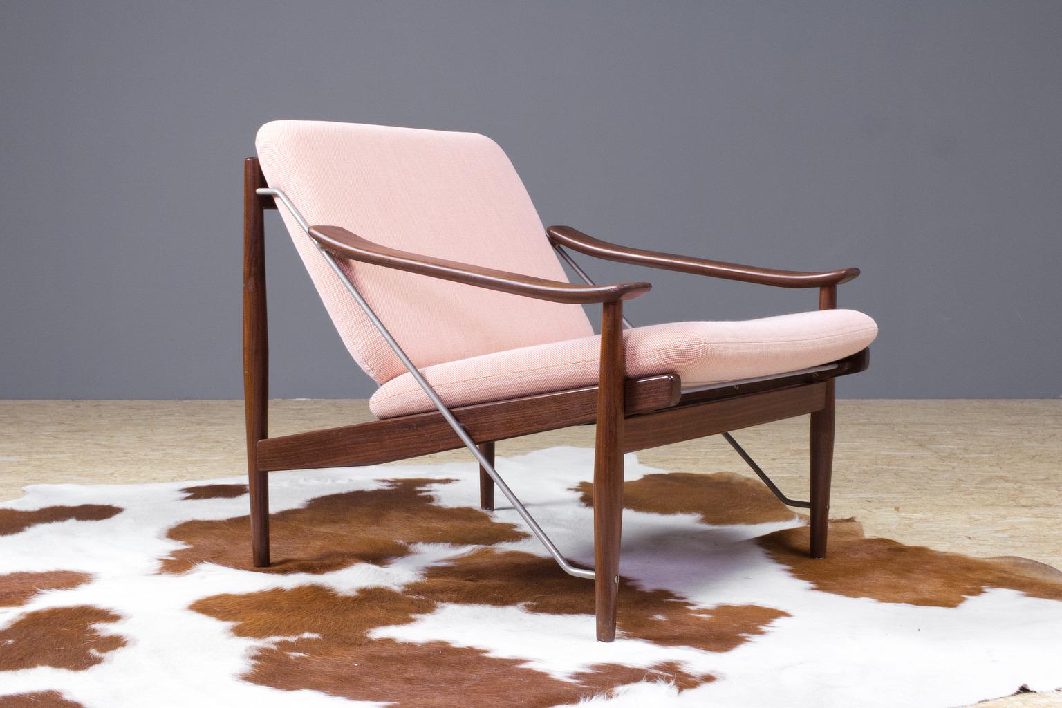 This vintage Danish lounge chair was imported in the Netherlands (1960s) by De Ster (Gelderland, NL). Designer unknown. We have an identical set in stock, are sold separate. 

A slender construction of teak and metal form the heart of this design. 