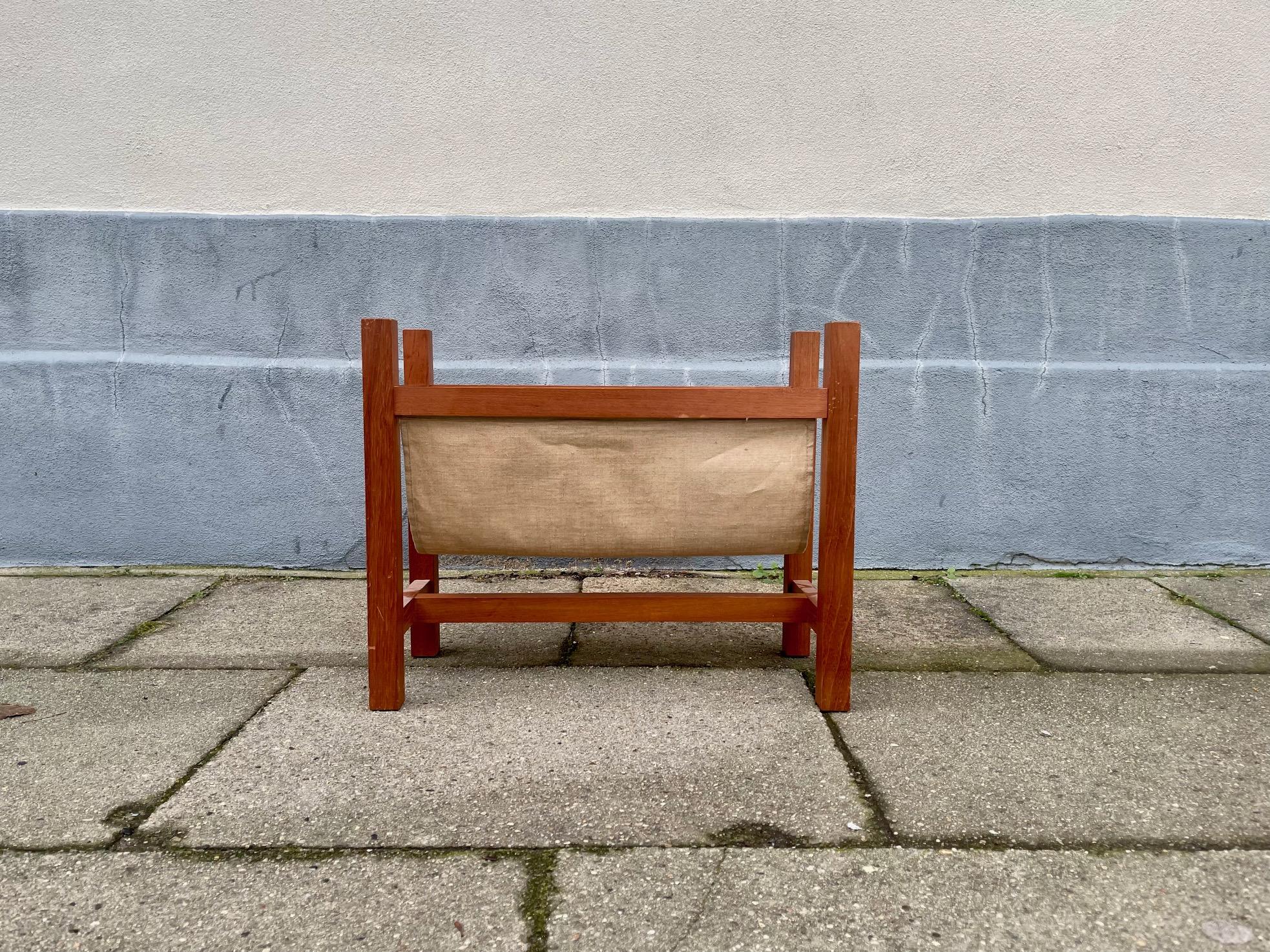 Magazine/Newspaper rack made from teak and natural linen. It was manufactured in Denmark during the 1960s by Skøde Skjern. Nice vintage condition with ware consistent with age and use. Measurements: 50x45x25 cm.
