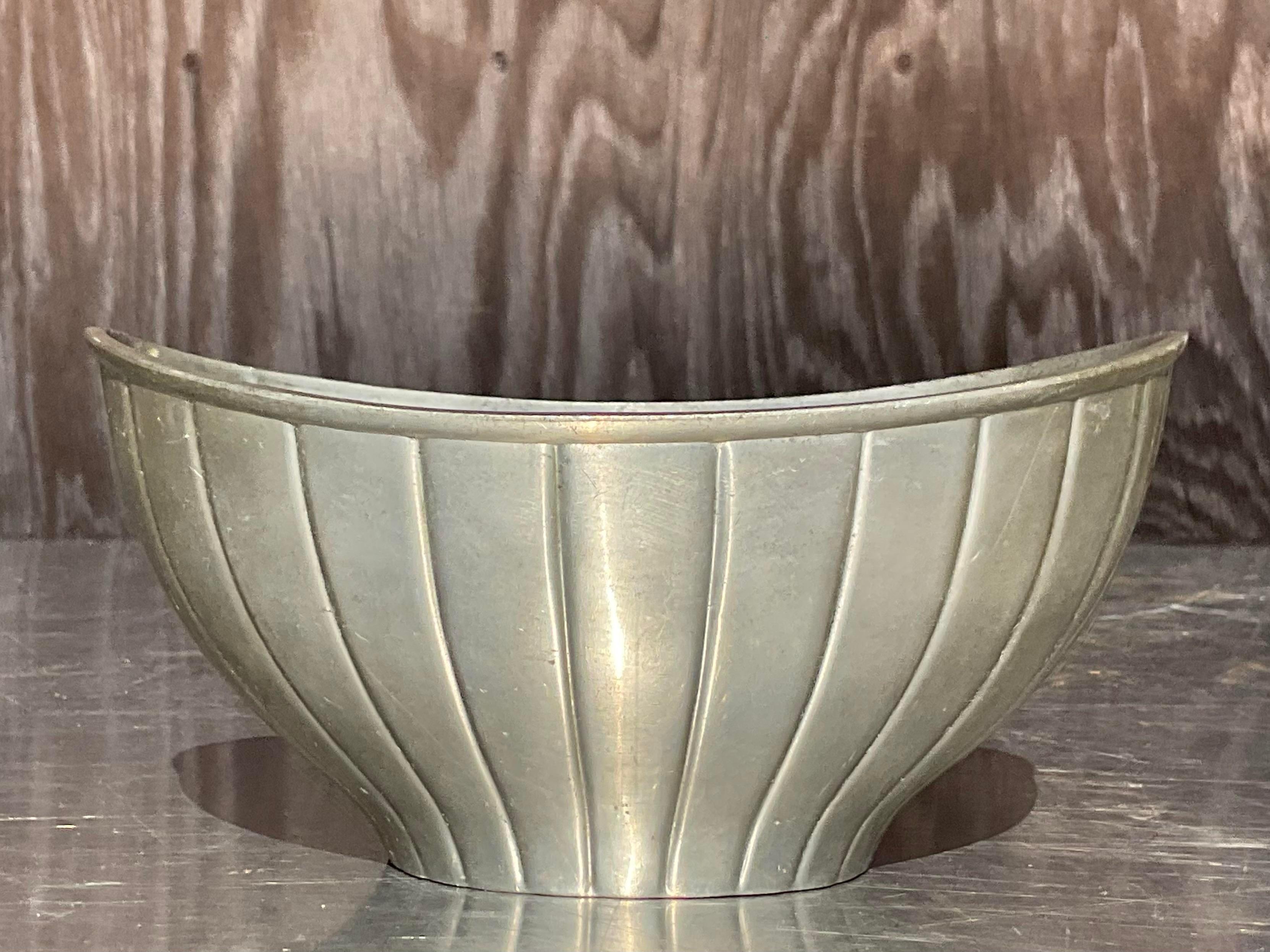 A fantastic vintage MCM pewter bowl. Made by the iconic Just Andersen and watermarked on the bottom. A stylish little catch all perfect in so many places. Acquired from a Palm Beach estate.