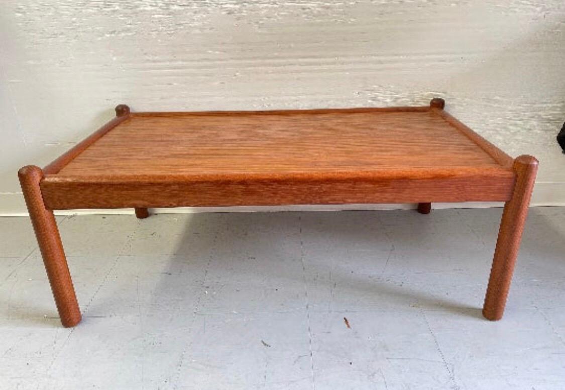 A beautiful solid teak Mid-Century Modern coffee table. A classic design and perfect addition to any space.