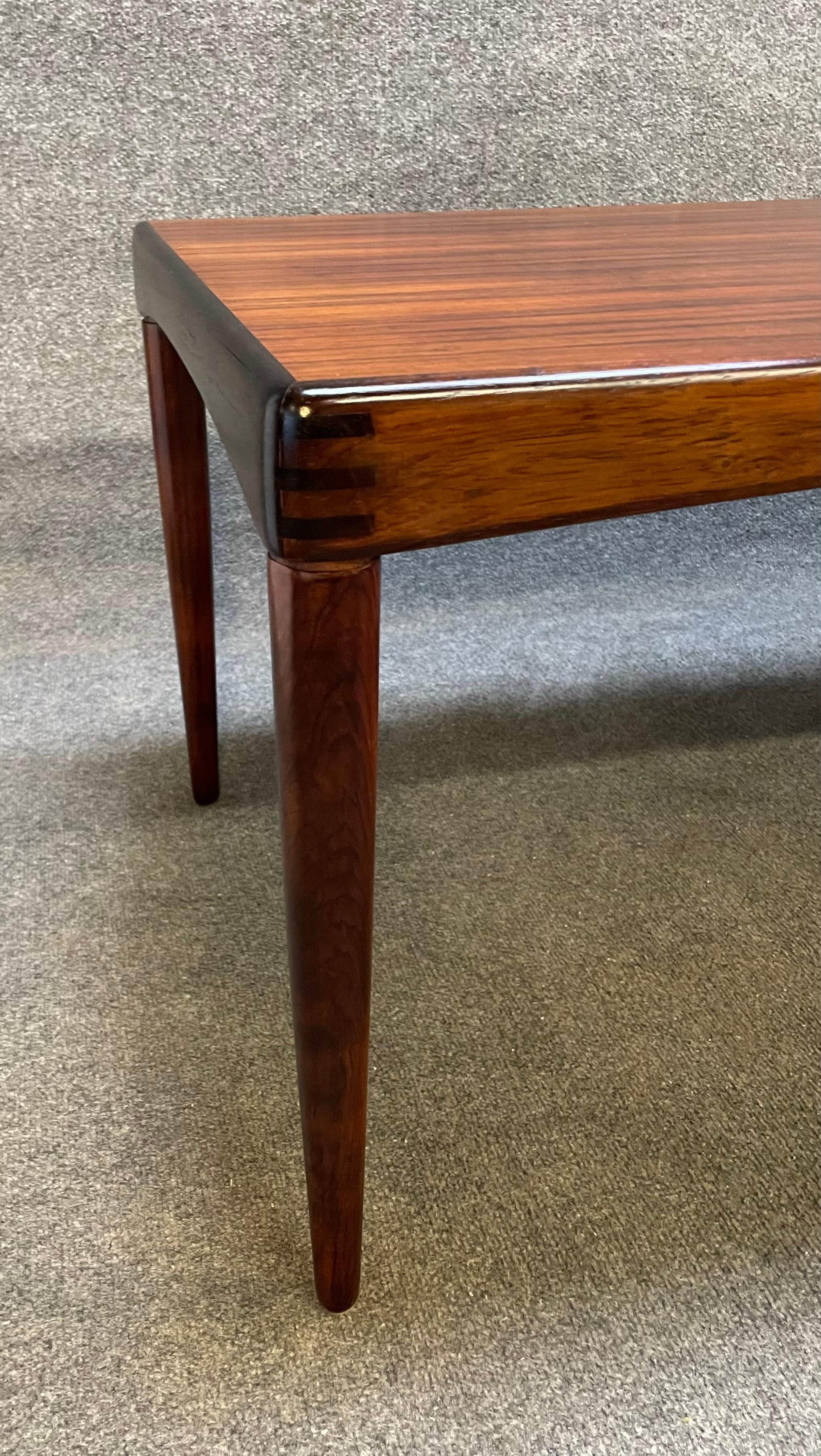 Here is a beautiful scandinavian modern cocktail table in rosewood designed by HW Klein and manufactured by Bramin Mobler in Denmark in the 1960's.
This exquisite table, recently imported from Europe to California before its refinishing, features a