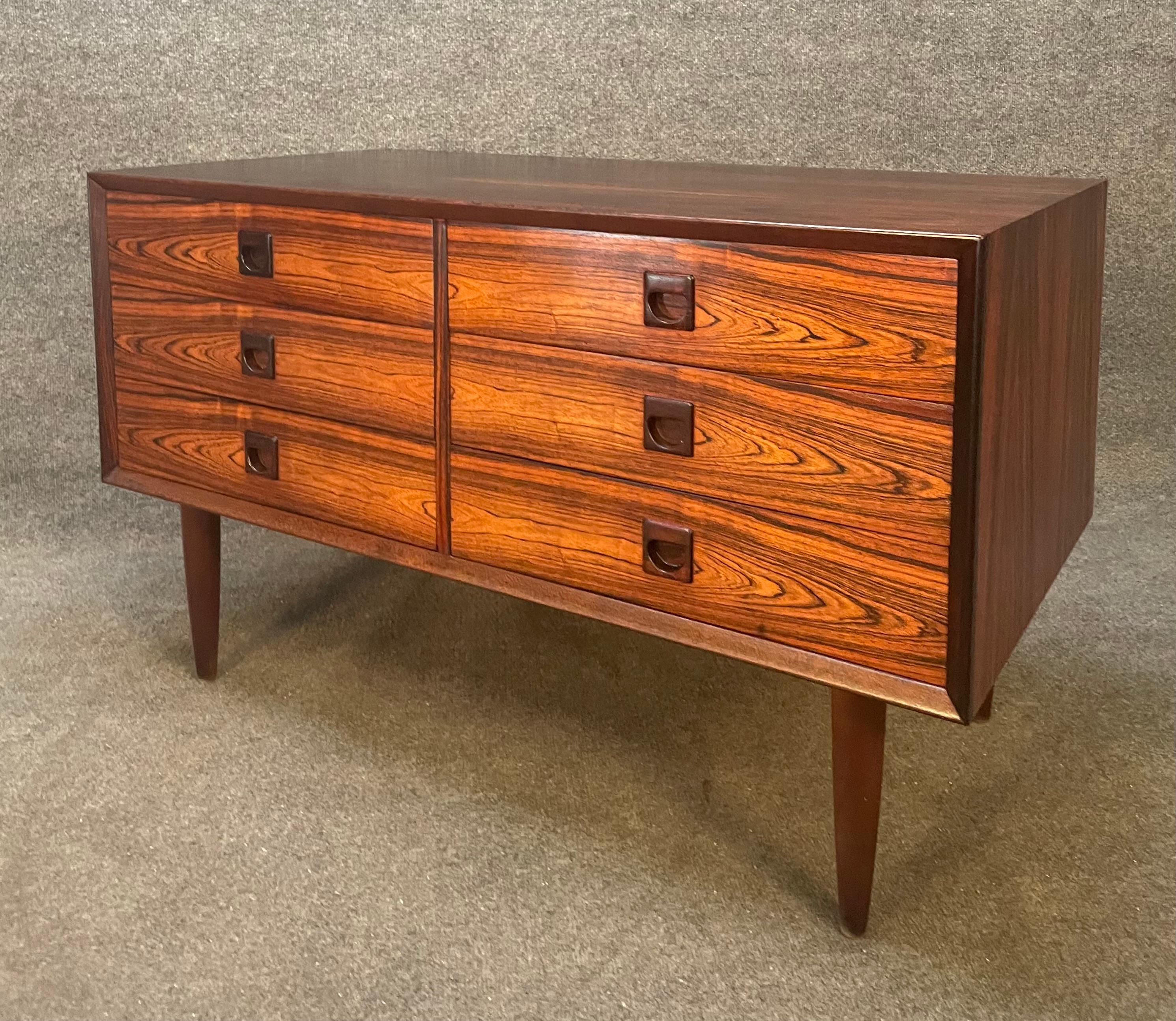 Here is a beautiful scandinavian modern compact credenza - console in rosewood manufactured by Brouer Mobelfabrik in Denmark in the 1960's.
This exquisite piece, recently imported from Europe to California before its refinishing, features a vibrant