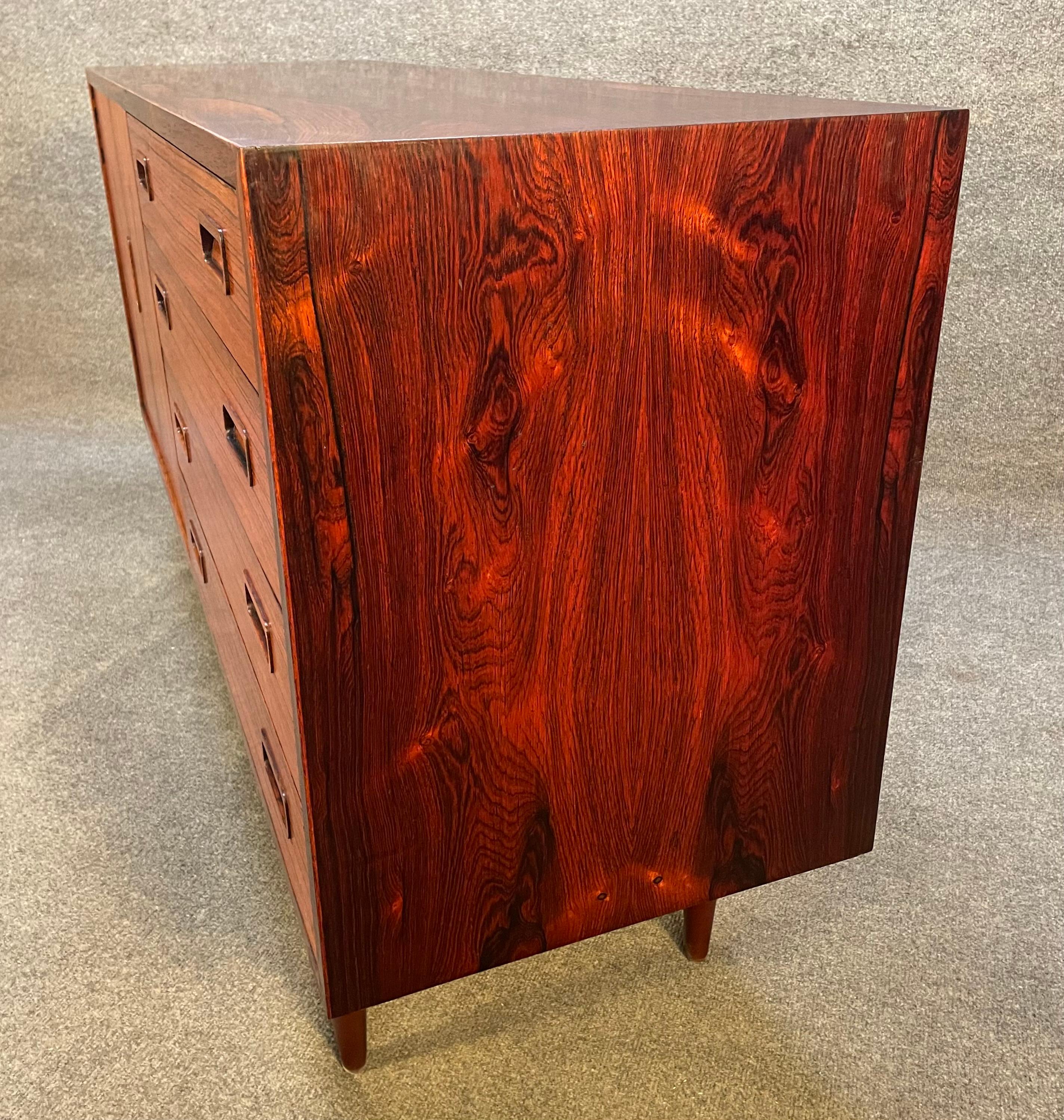 Here is a beautiful scandinavian modern sideboard in Brazilian rosewood designed by Carlo Jensen and manufactured by Poul Hundevad in Denmark in the 1960's.
This compact credenza, recently imported from Europe to California before its refinishing,