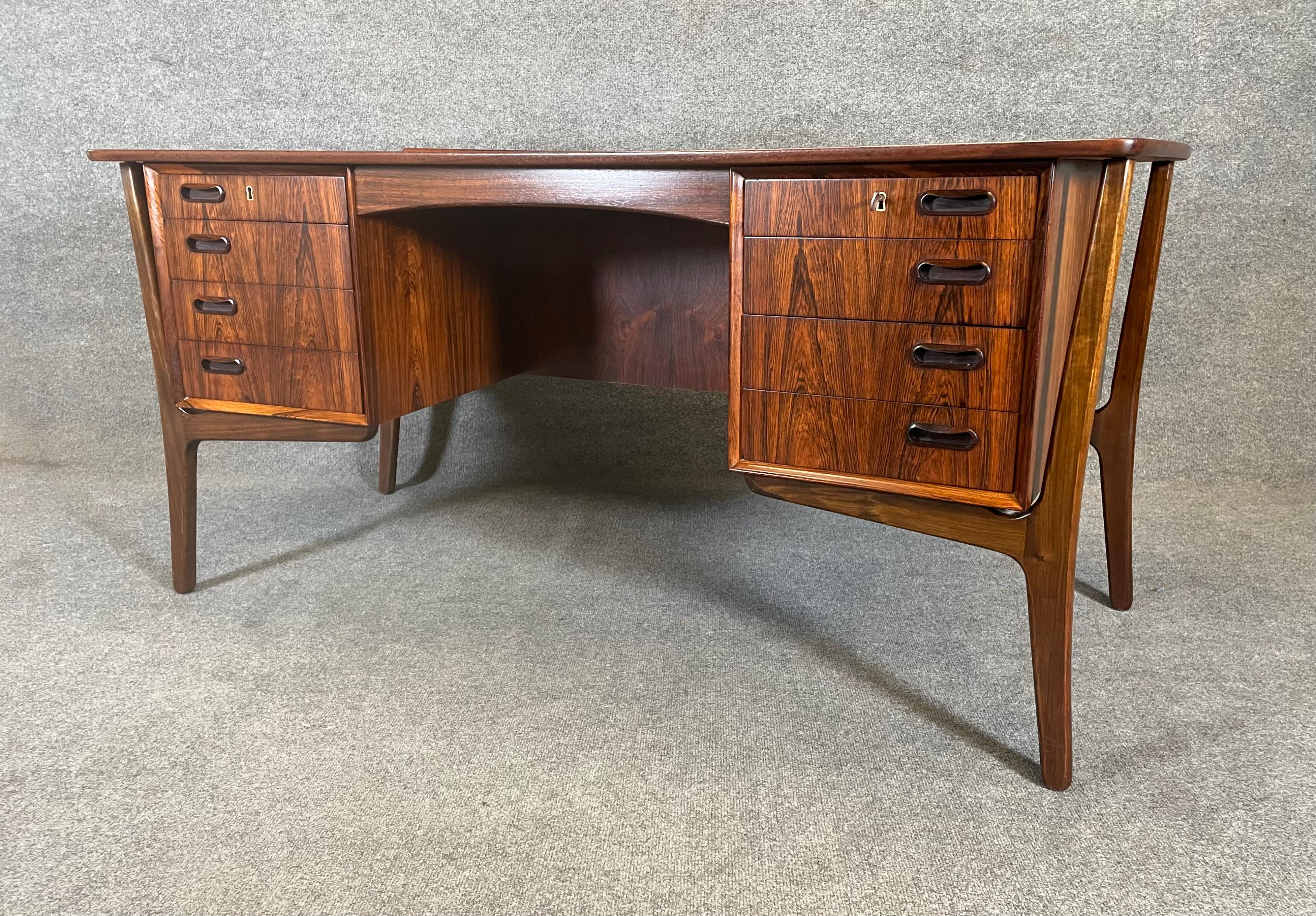Here is a beautiful and sought after scandinavian modern executive desk in rosewood designed by Svend Madsen and manufactured by HP Hansen in Denmark in the 1960's.
This special desk, recently imported from Europe to California before its
