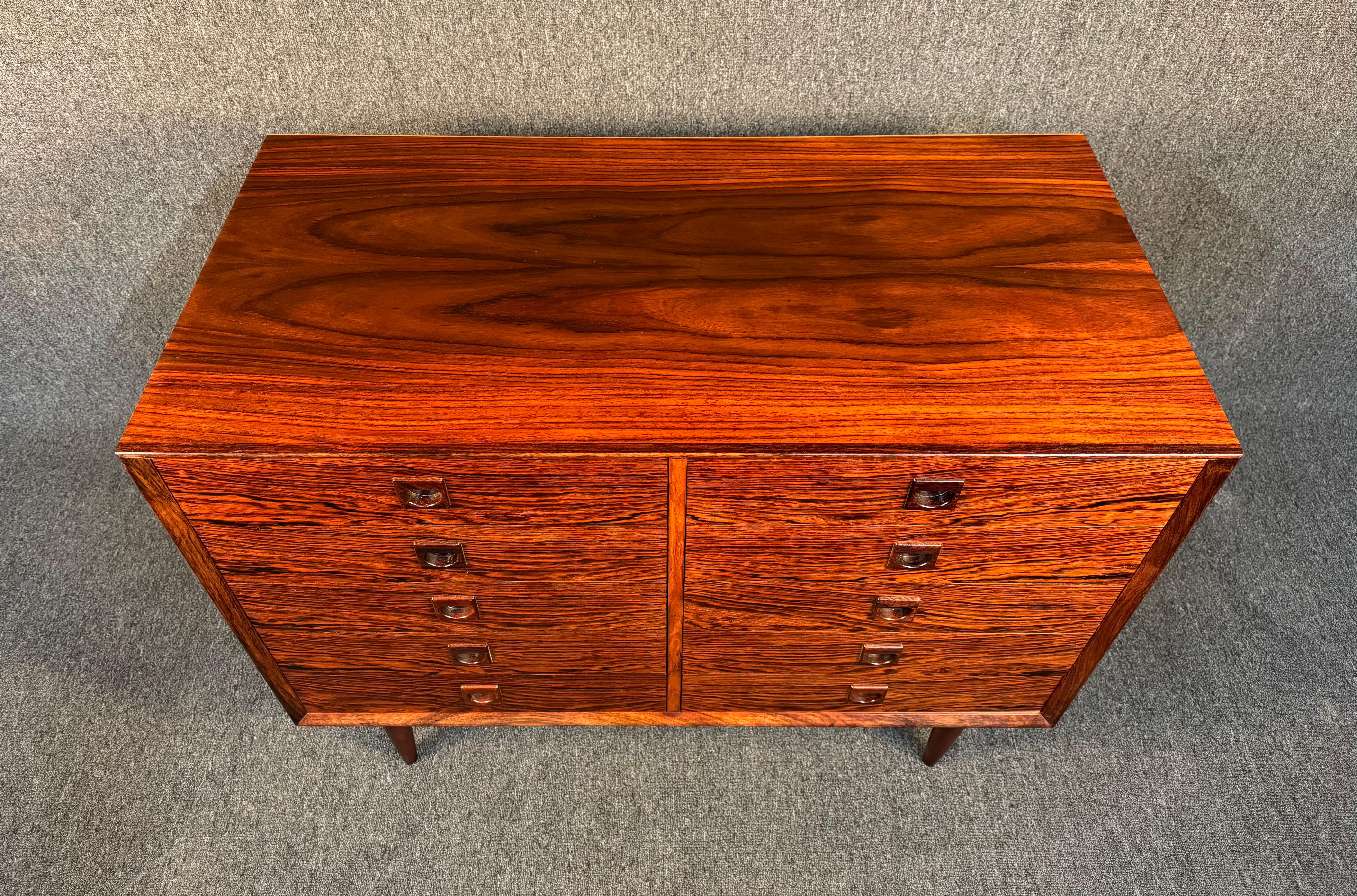Here is a beautiful Scandinavian modern dresser in rosewood manufactured in Denmark in the 1960's by Brouer Mobelfabrik.
This lovely piece, recently imported from Europe to California before its refinishing, features a lively wood grain showing lots